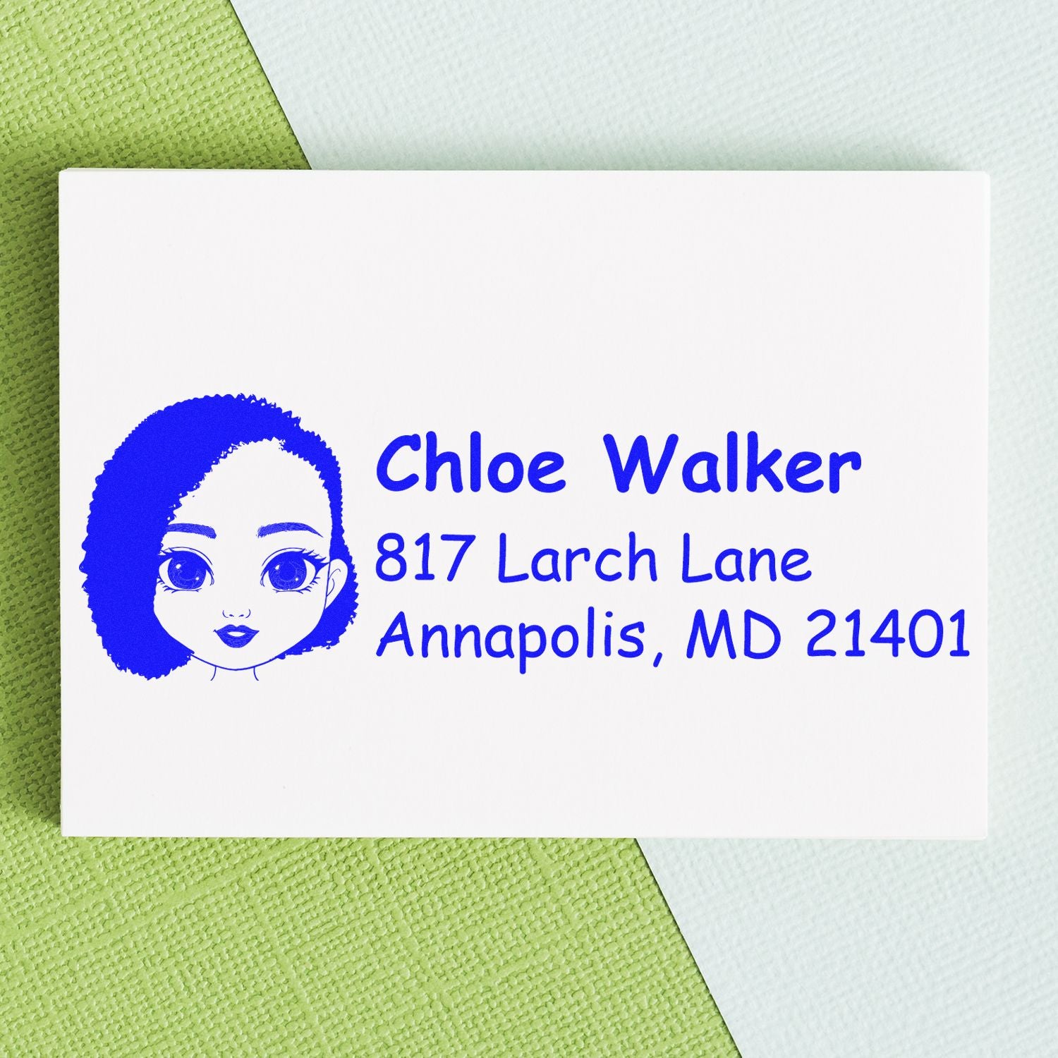 Custom rubber address stamp with illustrated portrait, featuring Chloe Walker and Annapolis, MD 21401.