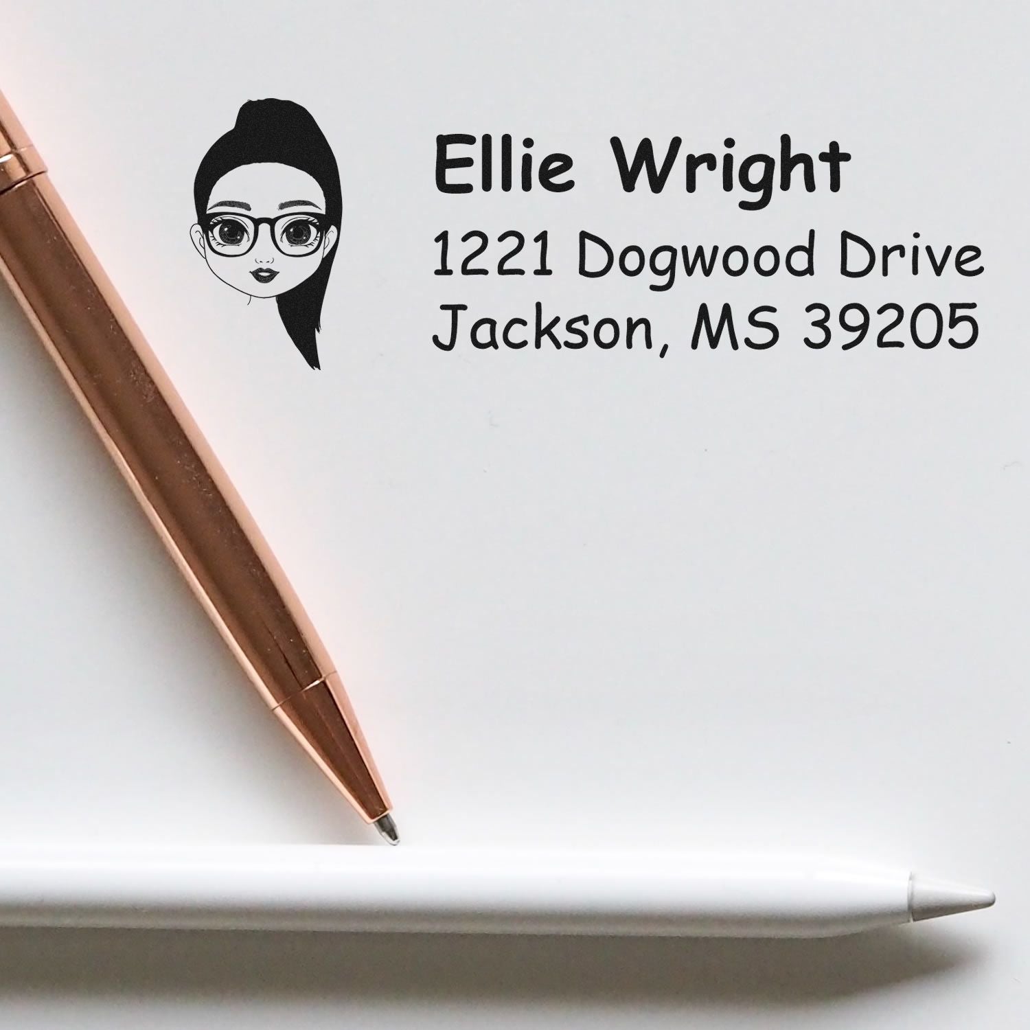 Personalized self-inking return address stamp with female avatar, name, and mailing address for envelopes and stationery.