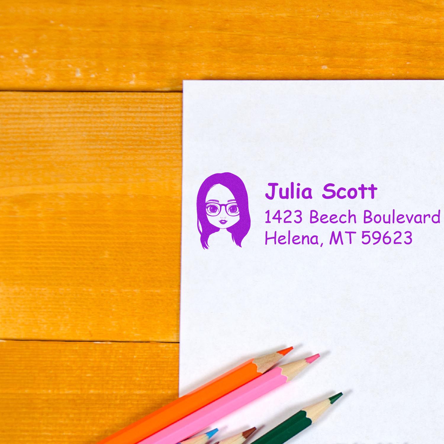 Custom rubber address stamp with name and mailing address on envelope for personalized stationery and return mail.