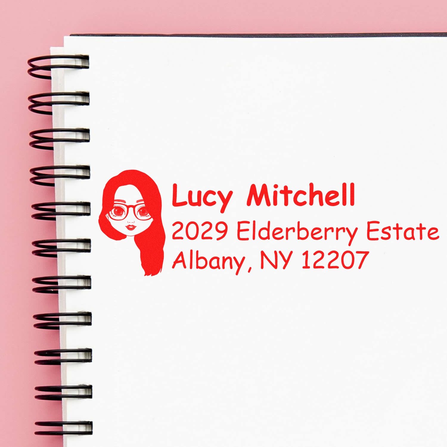 Personalized return address rubber stamp for Lucy Mitchell, 2029 Elderberry Estate, Albany, NY 12207, with woman illustration.