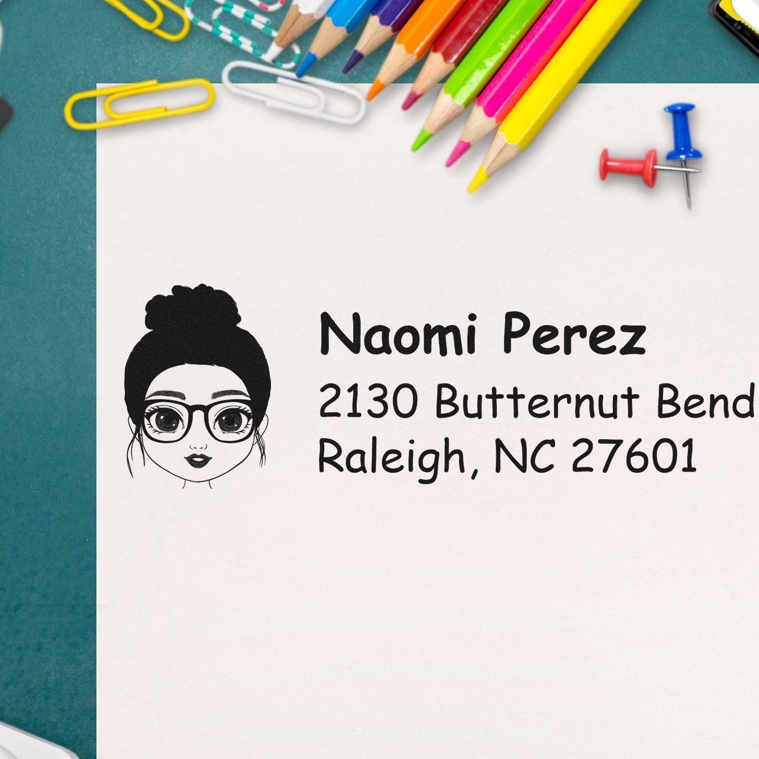 Personalized return address rubber stamp with girl icon for Naomi Perez, 2130 Butternut Bend, Raleigh, NC 27601.