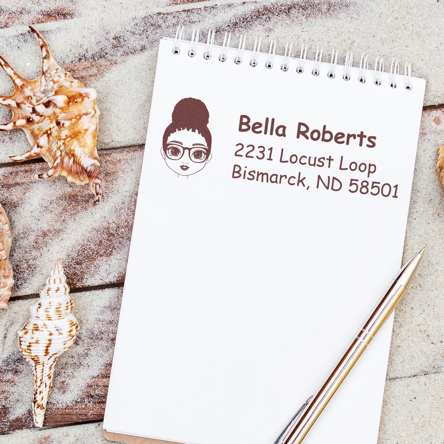 Custom return address rubber stamp with female avatar for Bella Roberts, Bismarck, ND 58501 on envelopes and mail.
