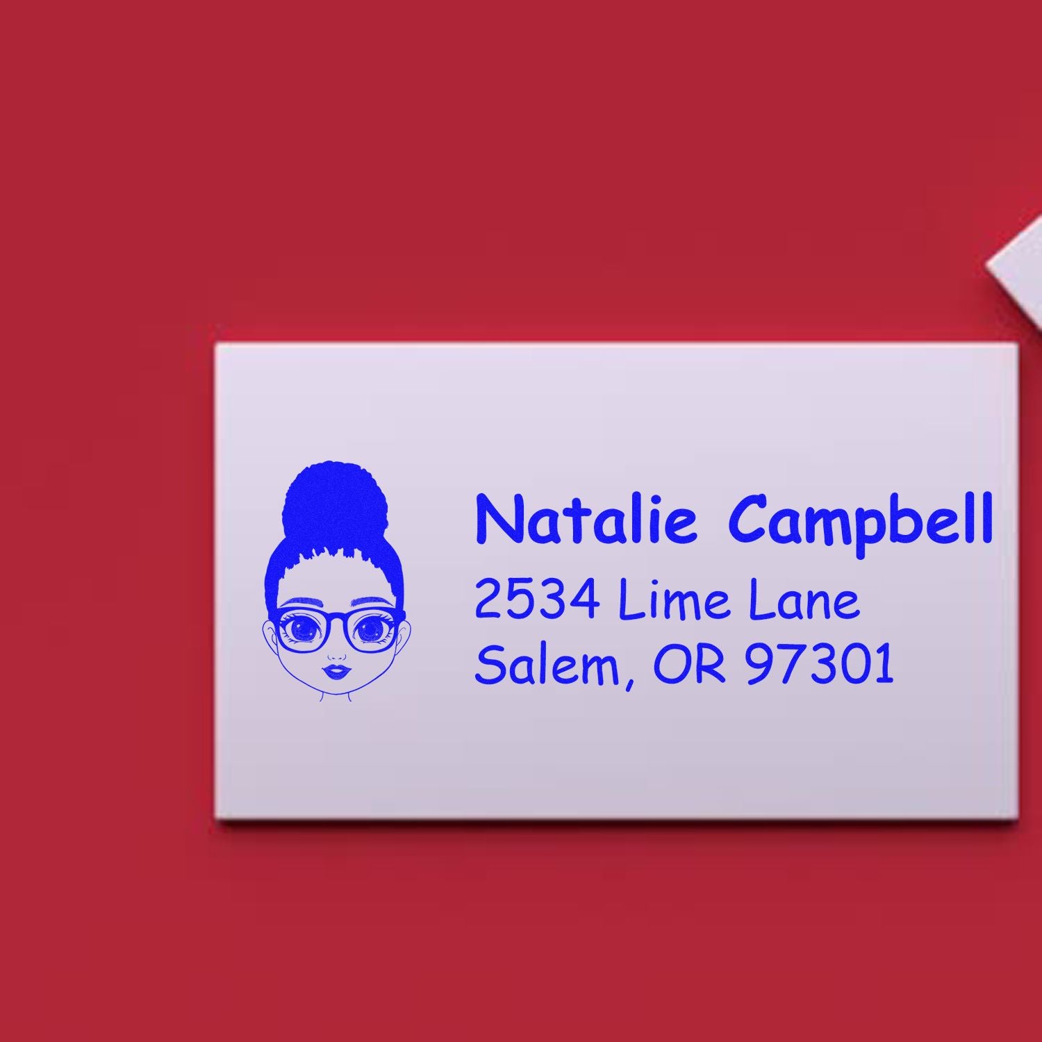 Custom rubber address stamp with girl face design for Natalie Campbell, Salem, OR mailing and return address use.