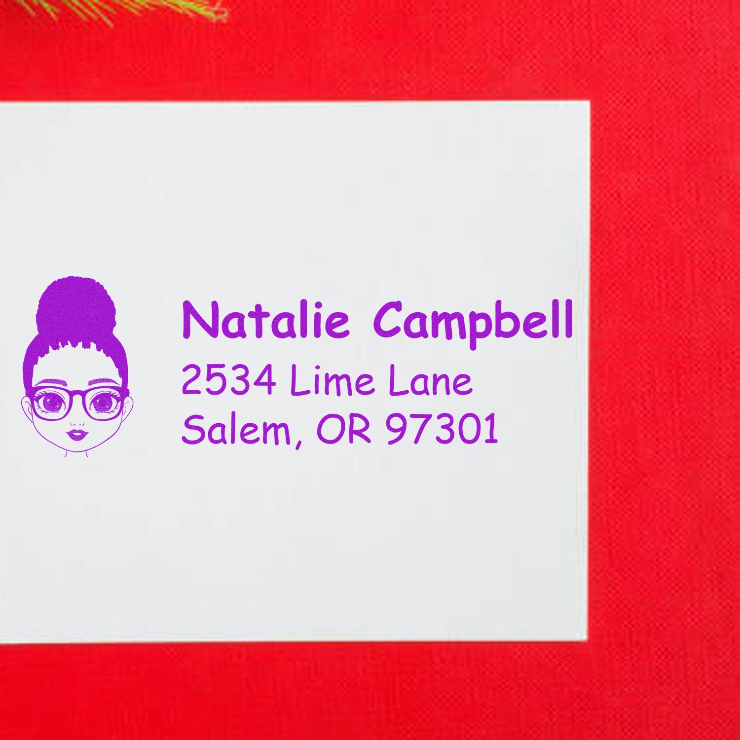 Personalized rubber address stamp with name Natalie Campbell, Salem OR 97301, and custom girl icon
