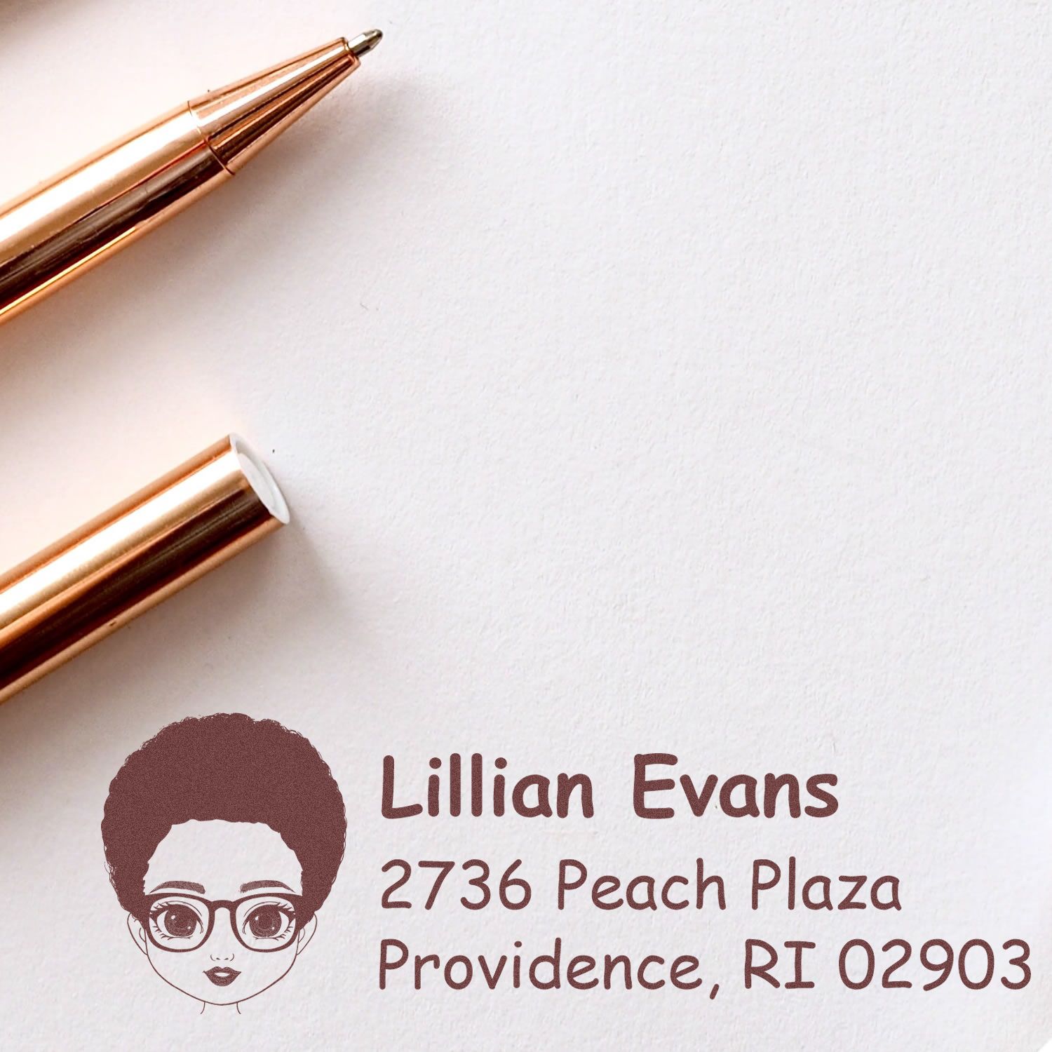 Personalized return address rubber stamp with illustrated avatar, name, and address for custom mailing labels.