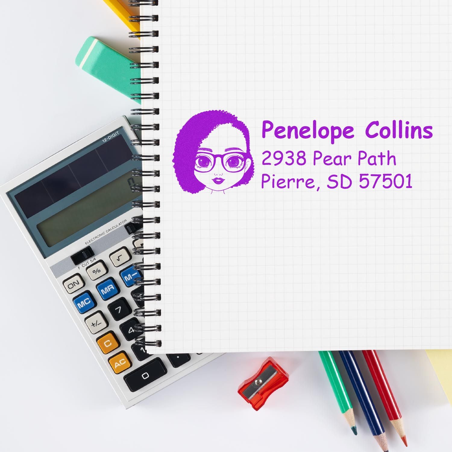 Personalized custom return address rubber stamp with name and address on notebook page, styled with calculator and pencils.