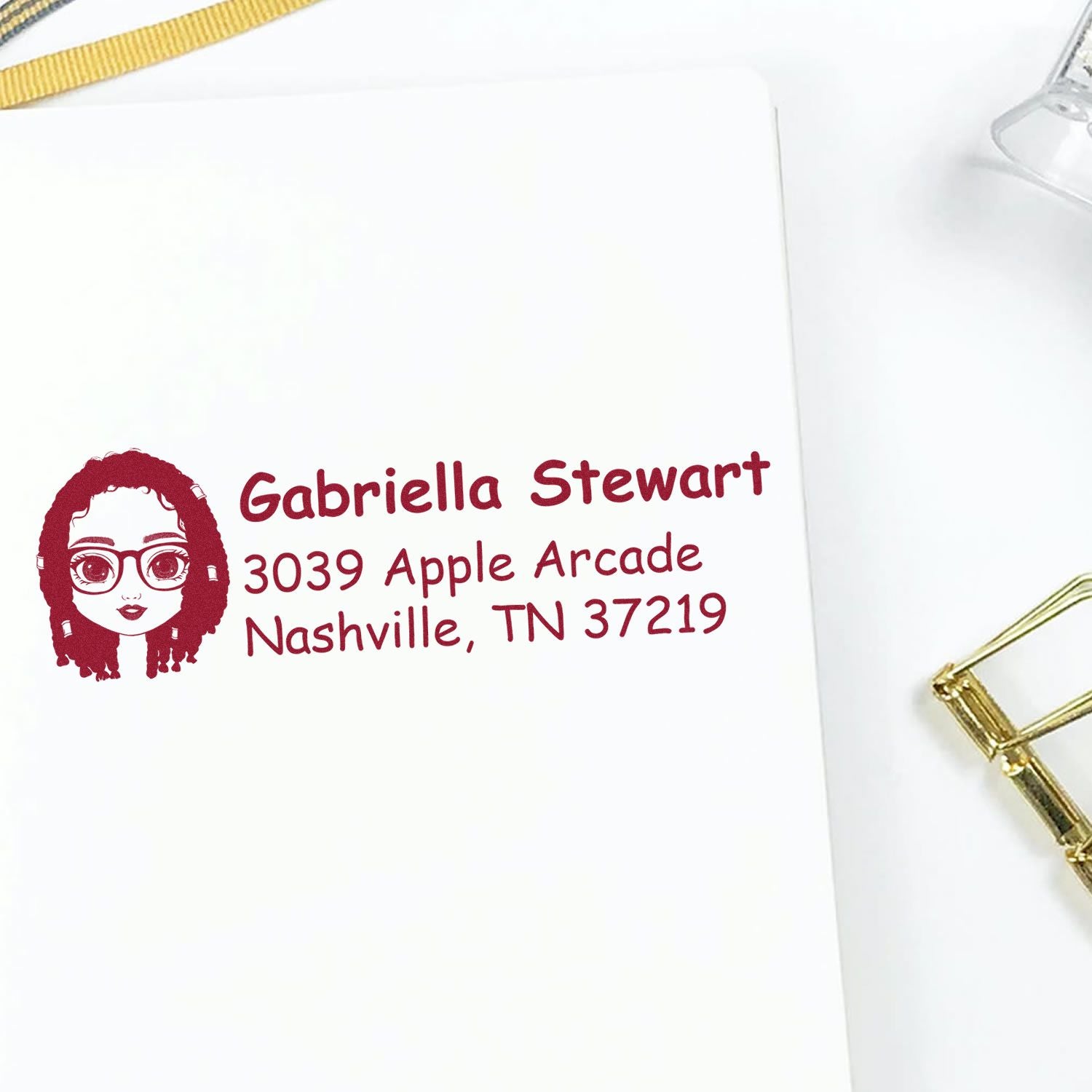Personalized custom rubber stamp impression with avatar logo and return address for Gabriella Stewart, Nashville, TN