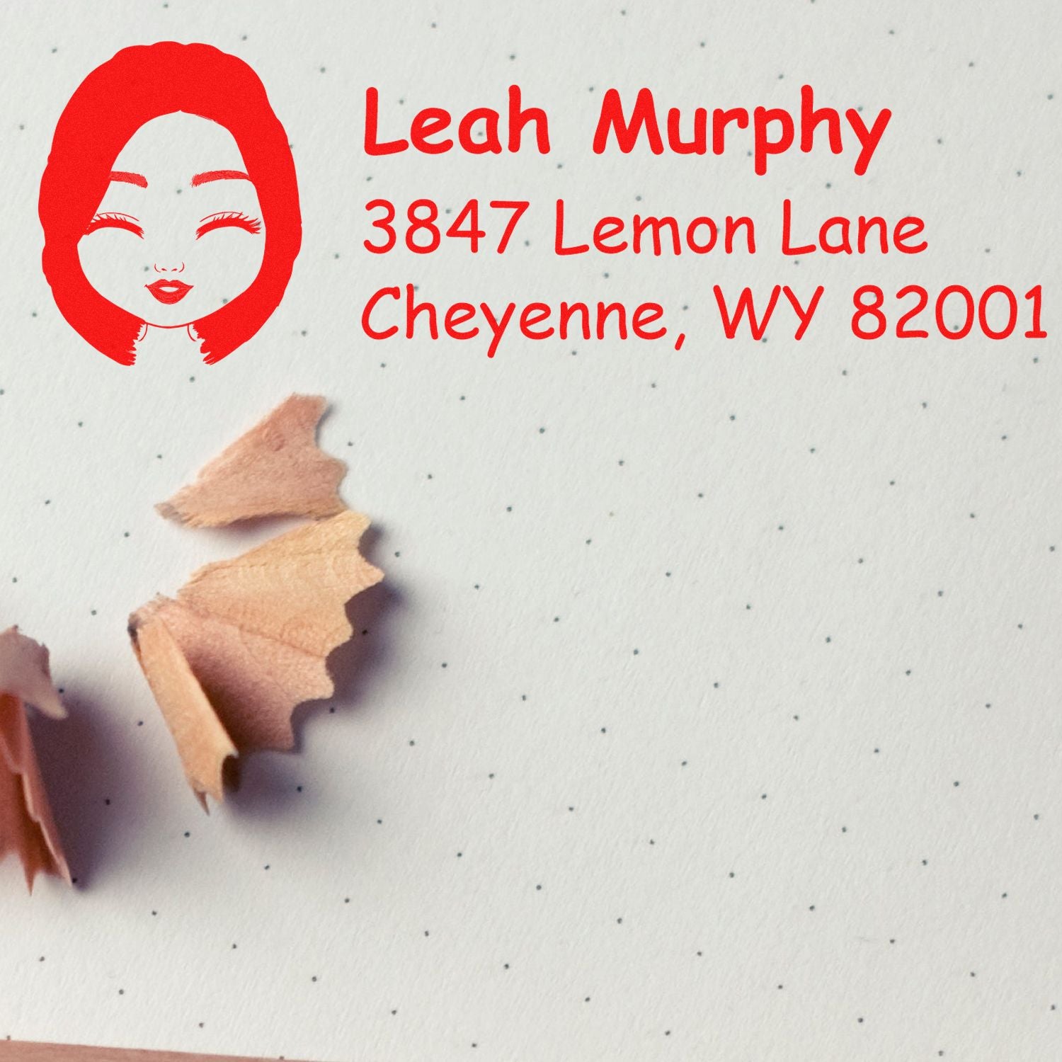 Custom return address rubber stamp with logo, reading Leah Murphy, 3847 Lemon Lane, Cheyenne, WY 82001.