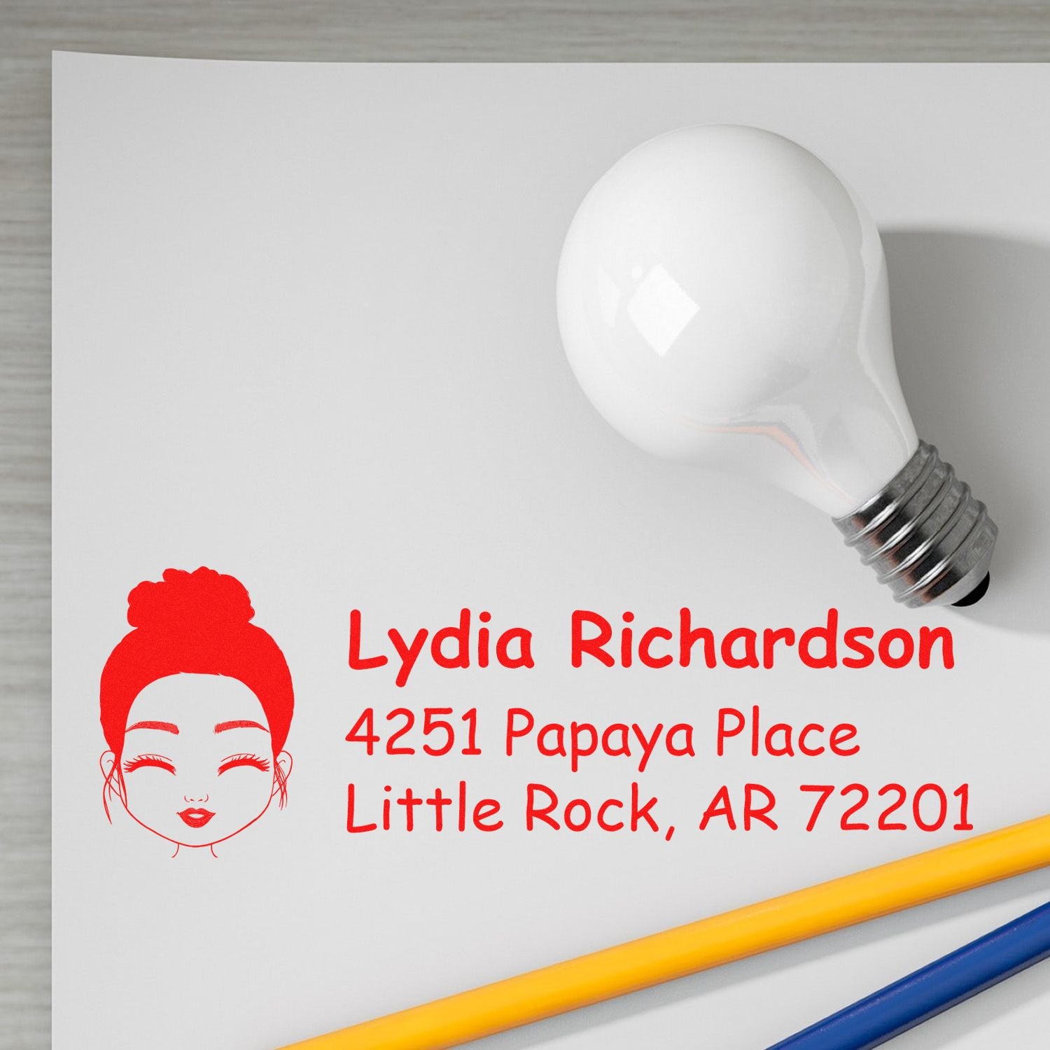 Custom personalized rubber address stamp with illustrated woman logo and Little Rock, AR return address.
