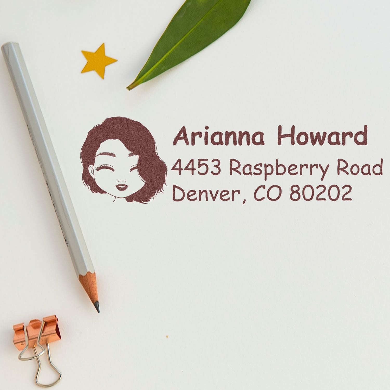 Custom rubber address stamp with portrait icon, name, and Denver, CO return address for personalized mailing.