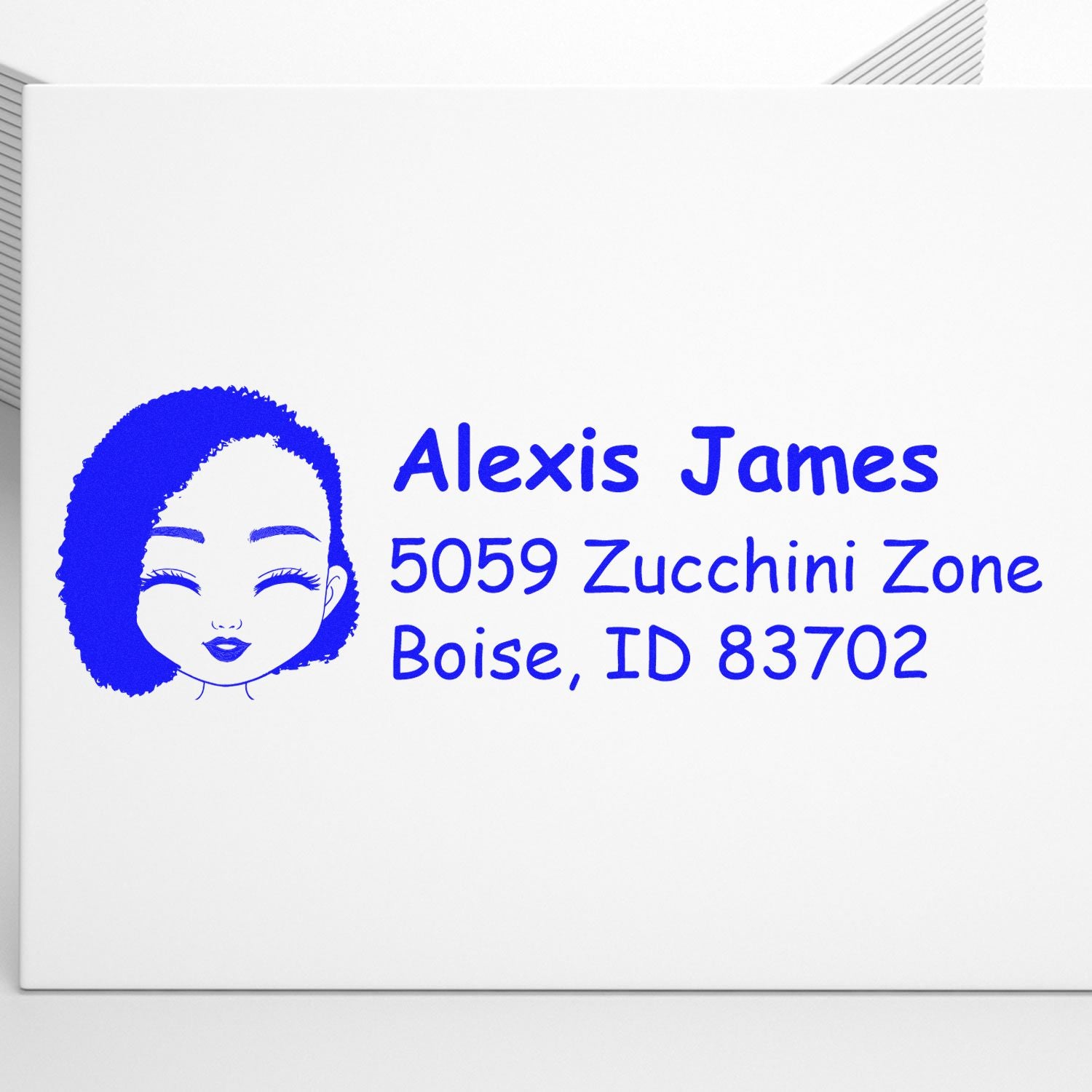 Personalized return address rubber stamp for Alexis James, Boise, ID 83702, with blue portrait logo.