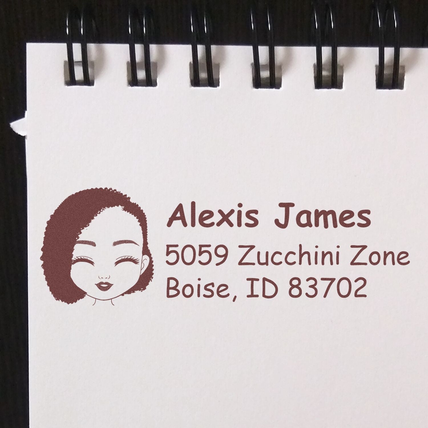Personalized rubber return address stamp with name, logo, and Boise, ID for envelopes and mailing.