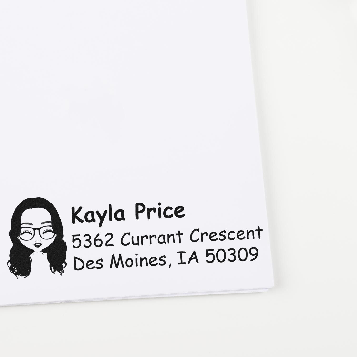 Personalized address rubber stamp with avatar, name, and return mailing address for envelopes and stationery.