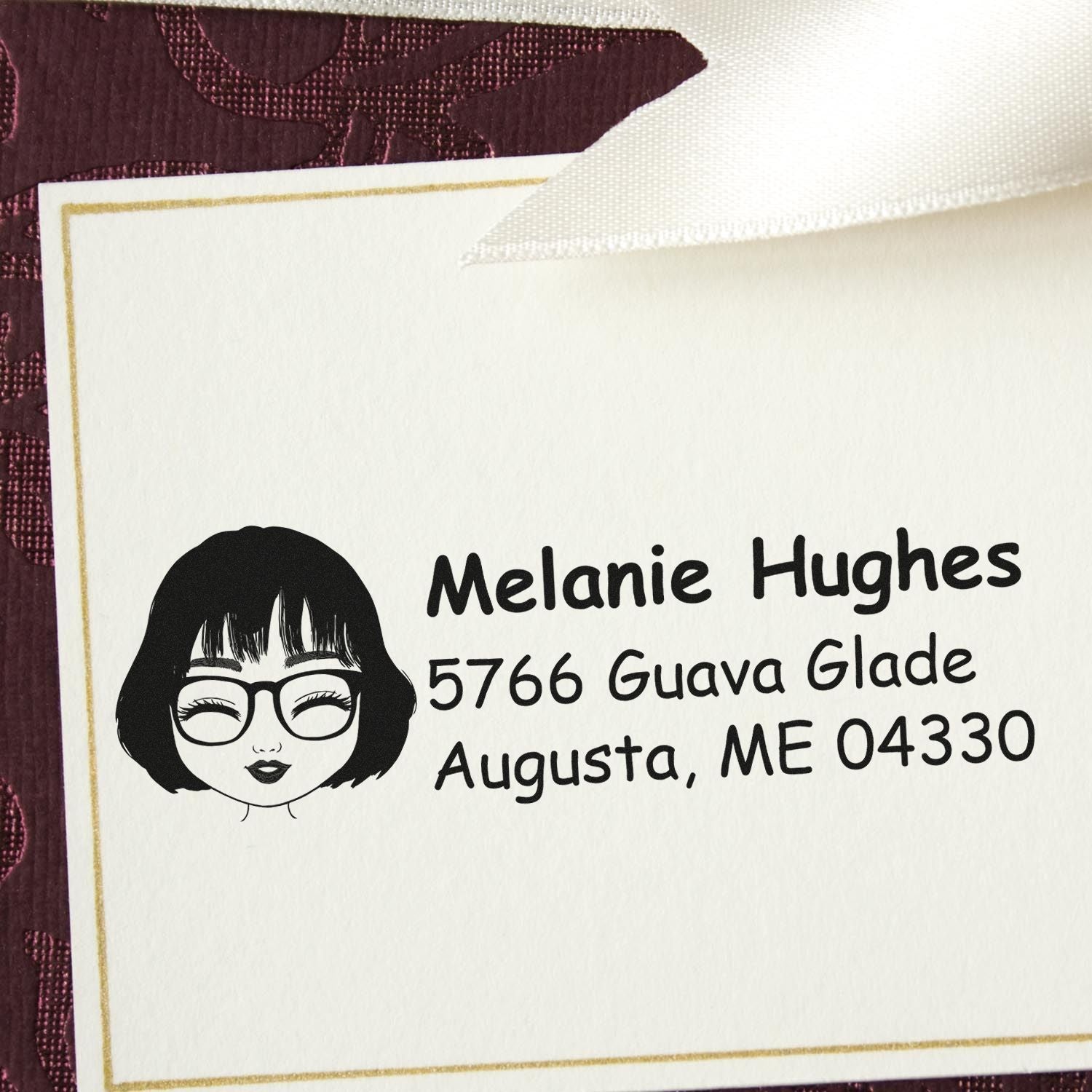 Personalized return address rubber stamp with female avatar icon for mailing envelopes and cards.