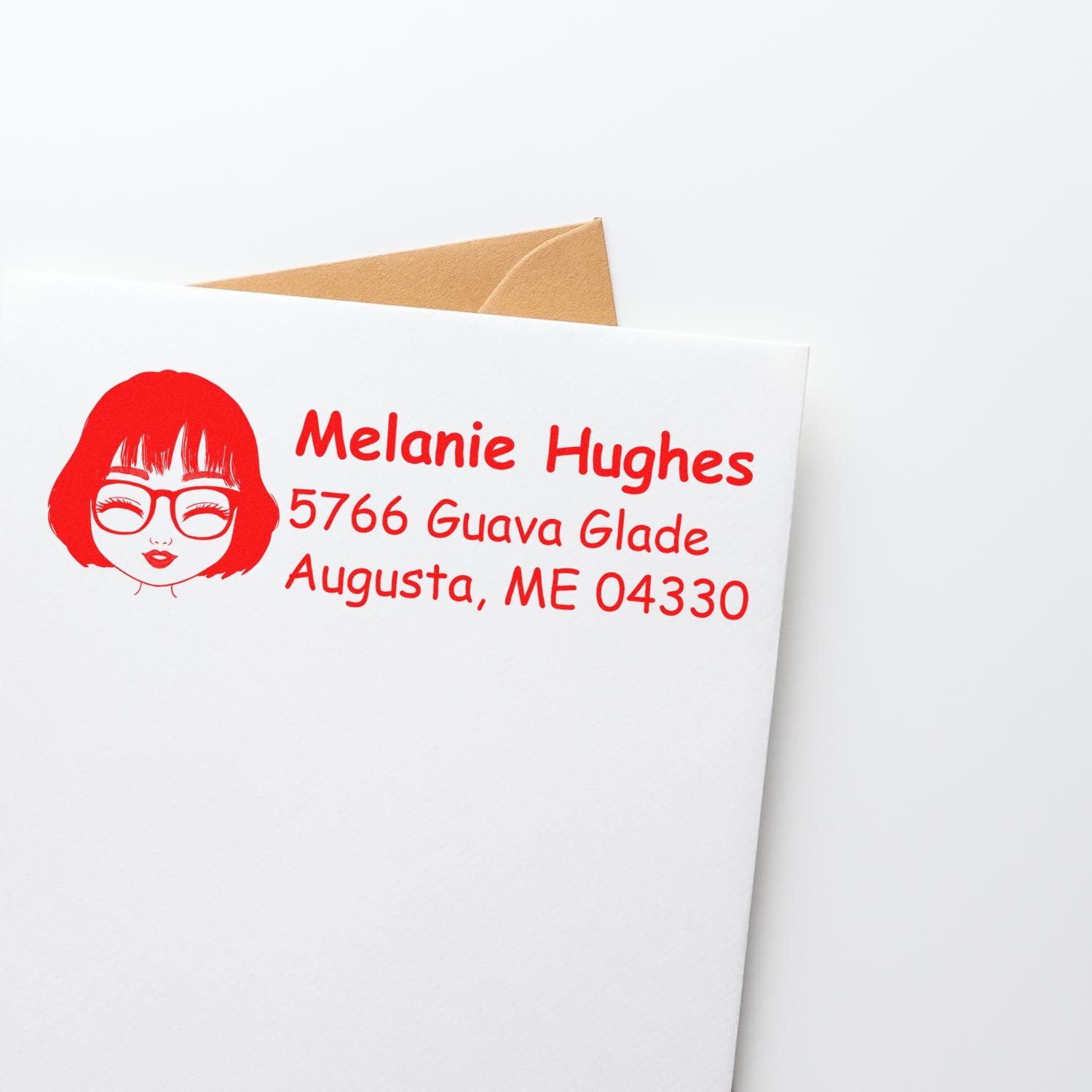 Personalized return address rubber stamp on white envelope with red female icon, name, and mailing address.