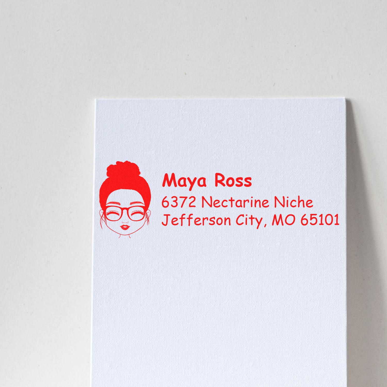 Custom rubber address stamp with name and return address for envelopes, business mail, and personalized branding.