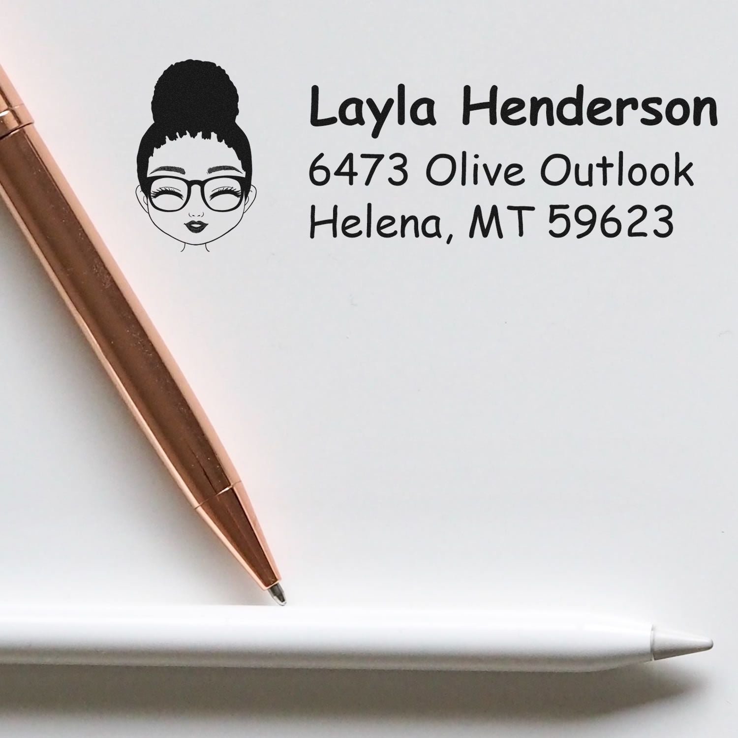 Personalized rubber stamp with illustrated woman logo and return address for custom mail and branding.