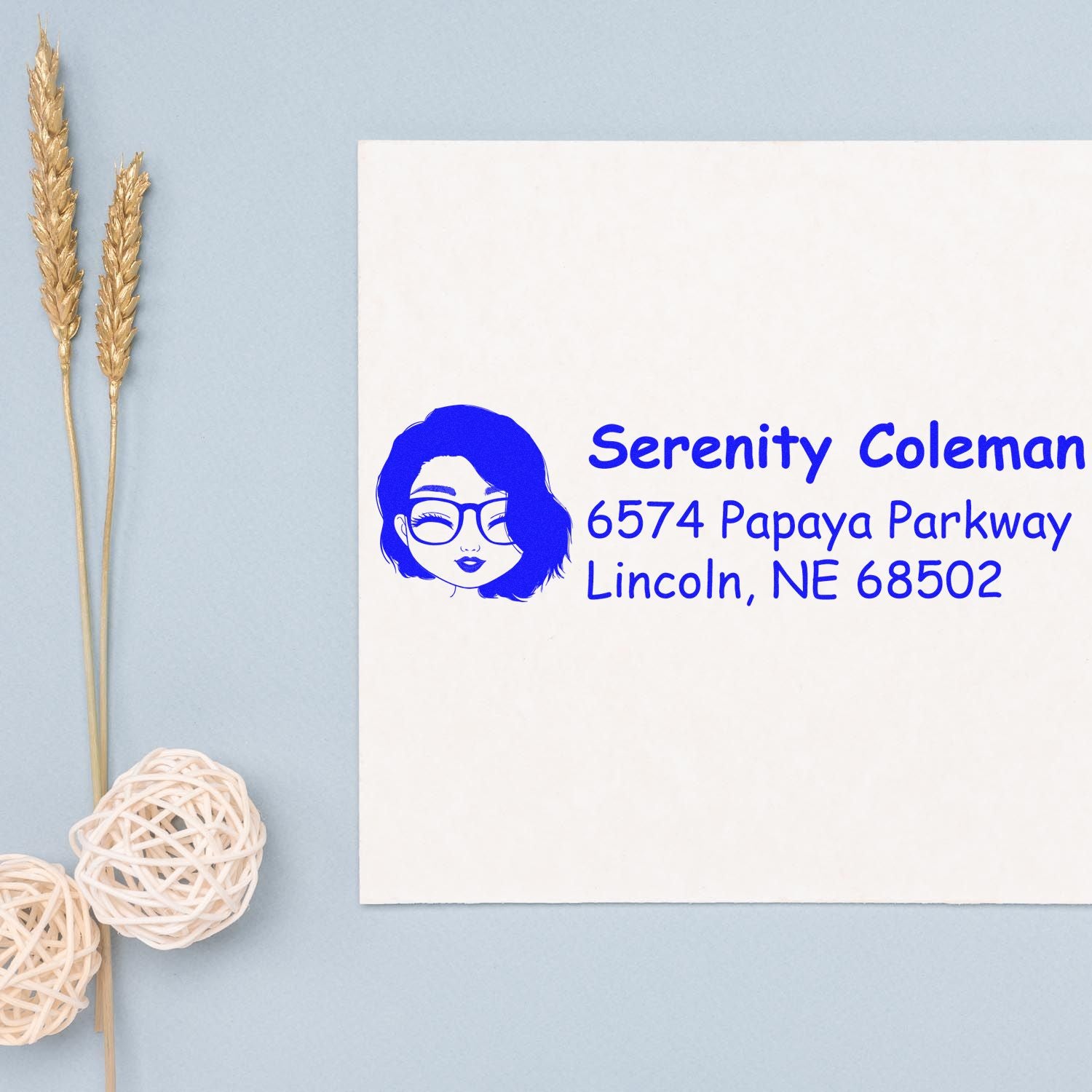 Custom return address rubber stamp with female avatar logo and Serenity Coleman address in Lincoln, NE 68502.