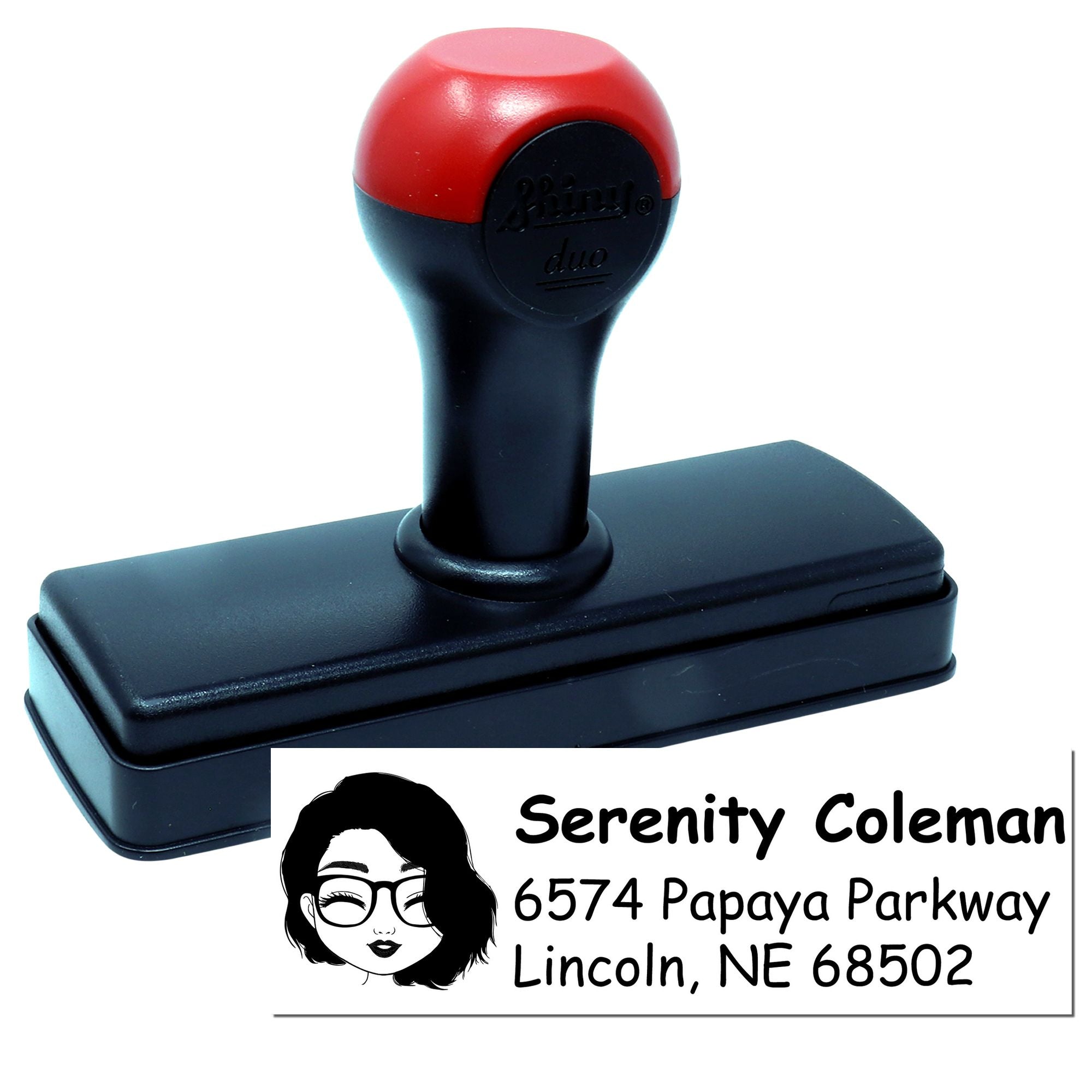 Self-inking rubber address stamp with custom name and return address imprint for personal or business mail.