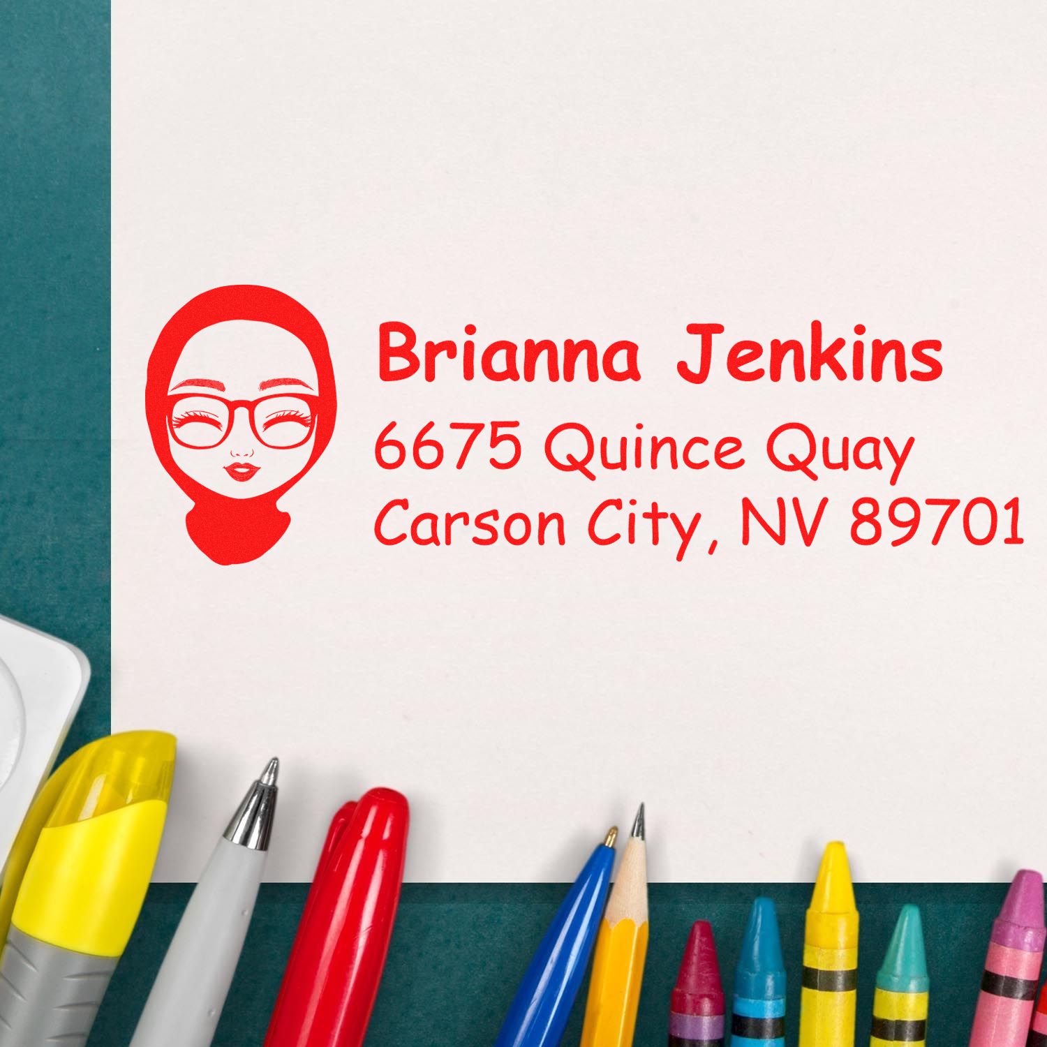 Personalized rubber address stamp with name and Carson City, NV mailing address in red ink.