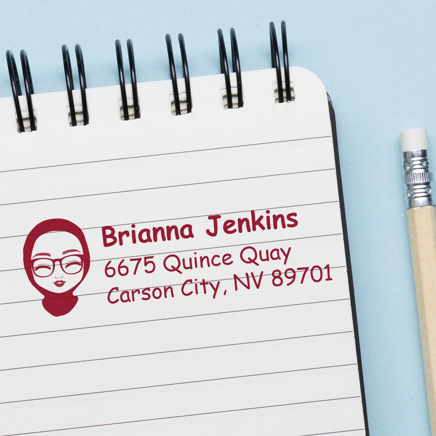 Personalized return address rubber stamp with name and Carson City, NV address on notepad