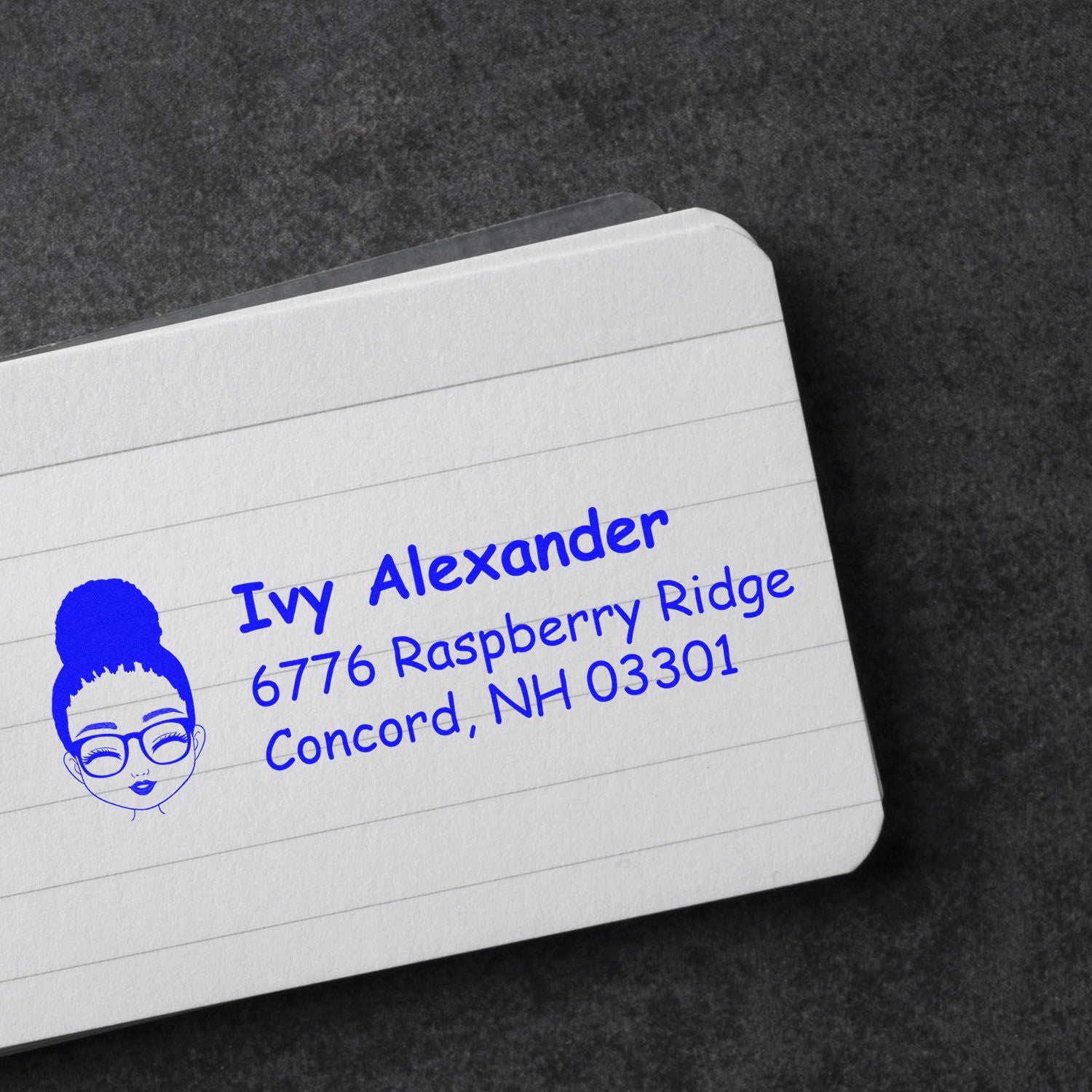Custom address rubber stamp with illustrated face logo for Ivy Alexander, Concord, NH, for mailing envelopes.