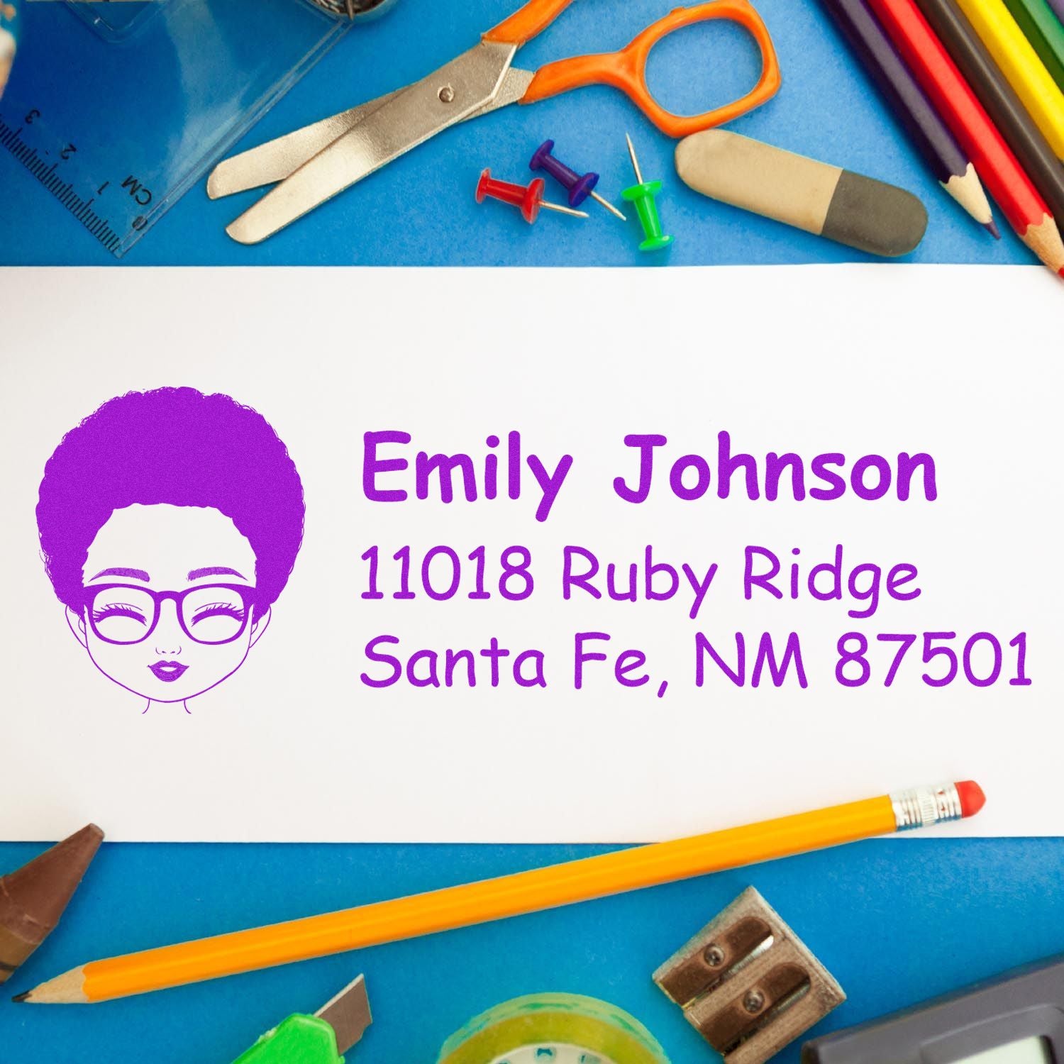 Personalized rubber address stamp with avatar and return address, shown on a colorful school-supplies background.