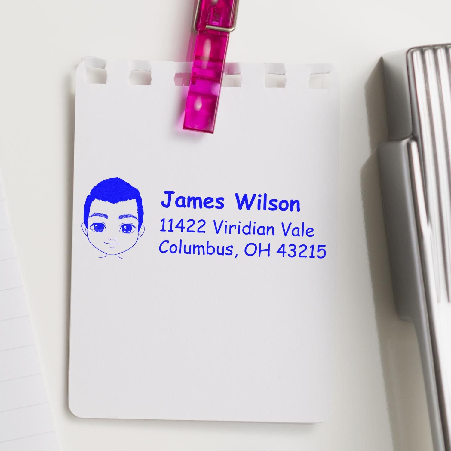 Personalized address rubber stamp with cartoon portrait, showing James Wilson and Columbus, OH 43215.