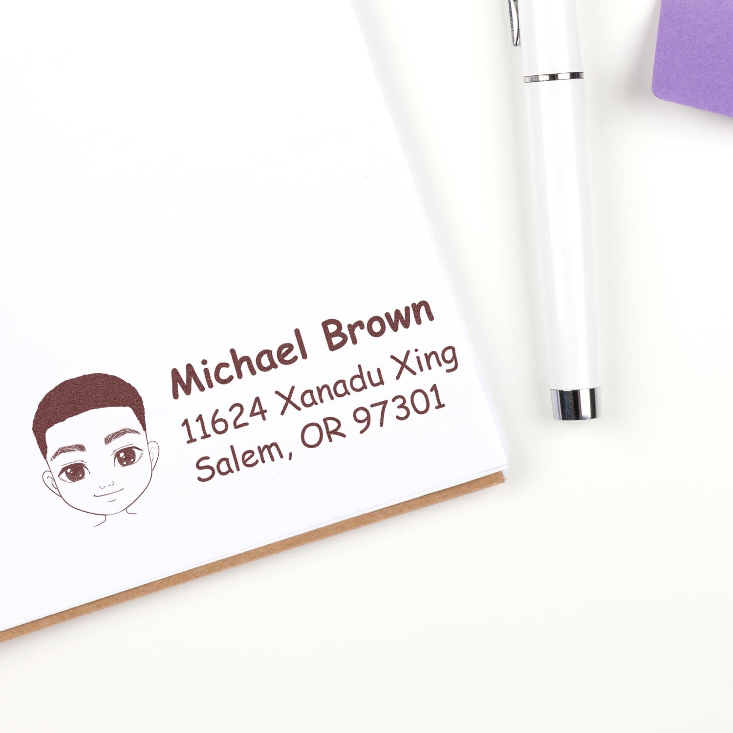 Custom return address rubber stamp on stationery with name, address and cartoon portrait for mailing envelopes.