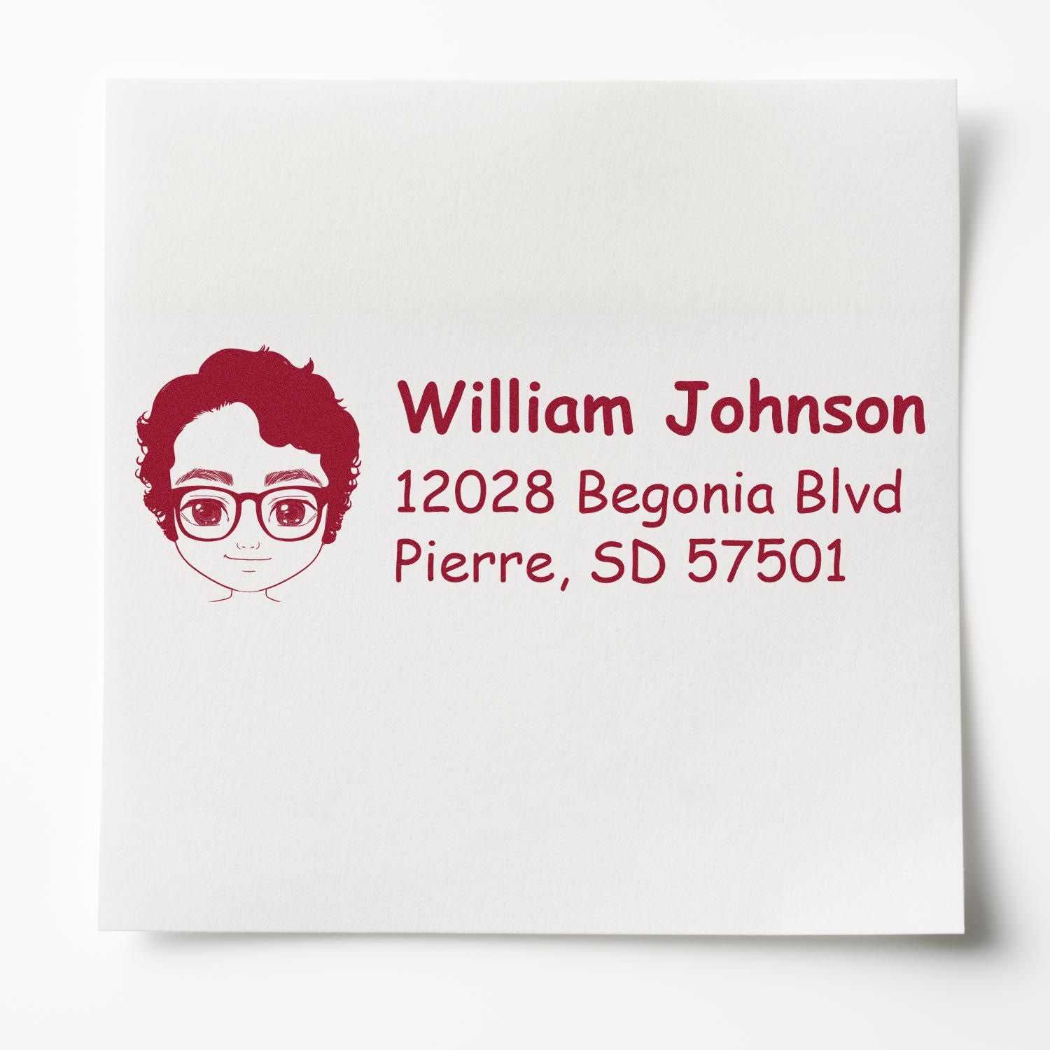 Personalized address rubber stamp with cartoon portrait for William Johnson, 12028 Begonia Blvd, Pierre, SD 57501.