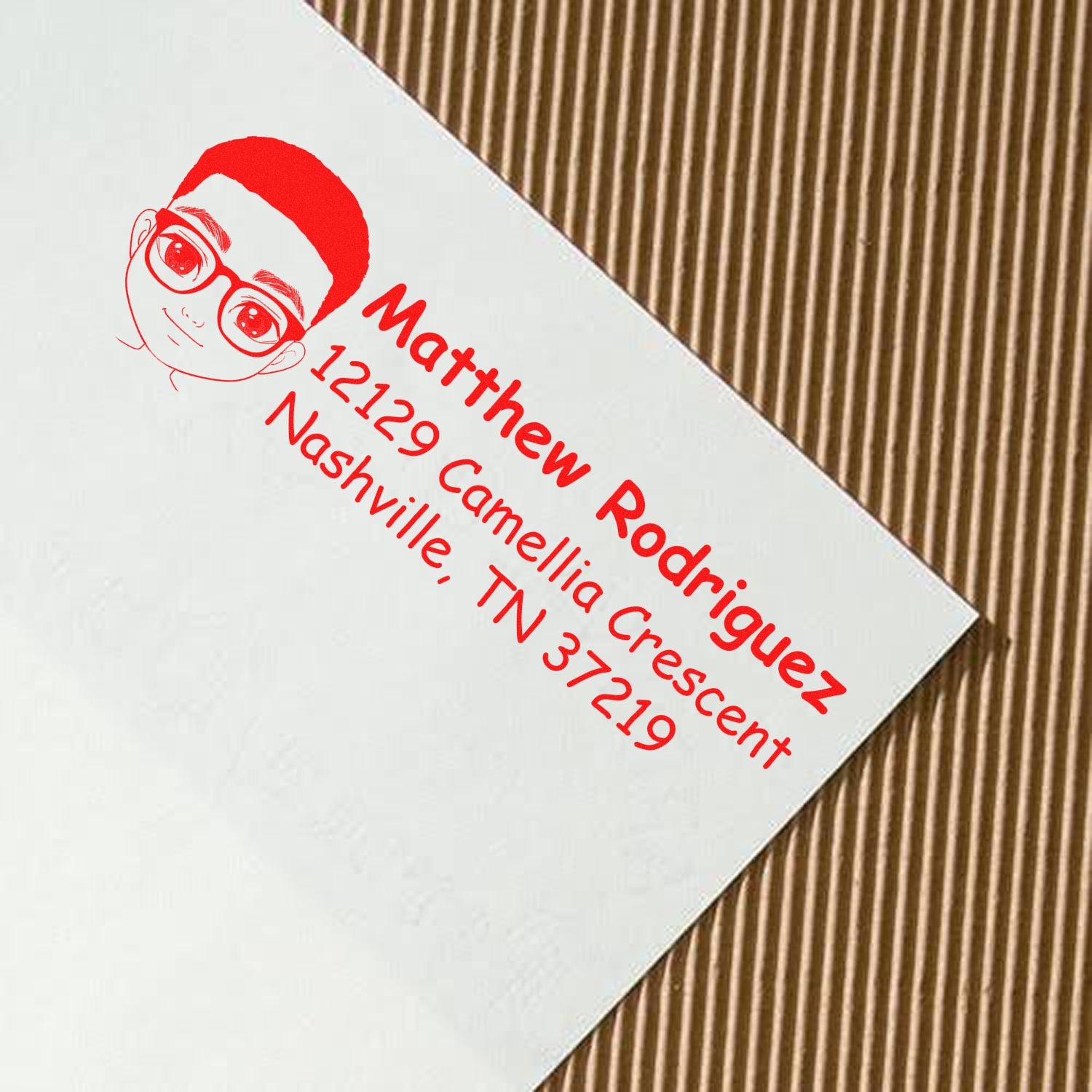 Custom name and address rubber stamp for Matthew Rodriguez, Nashville, TN 37219 with cartoon avatar.