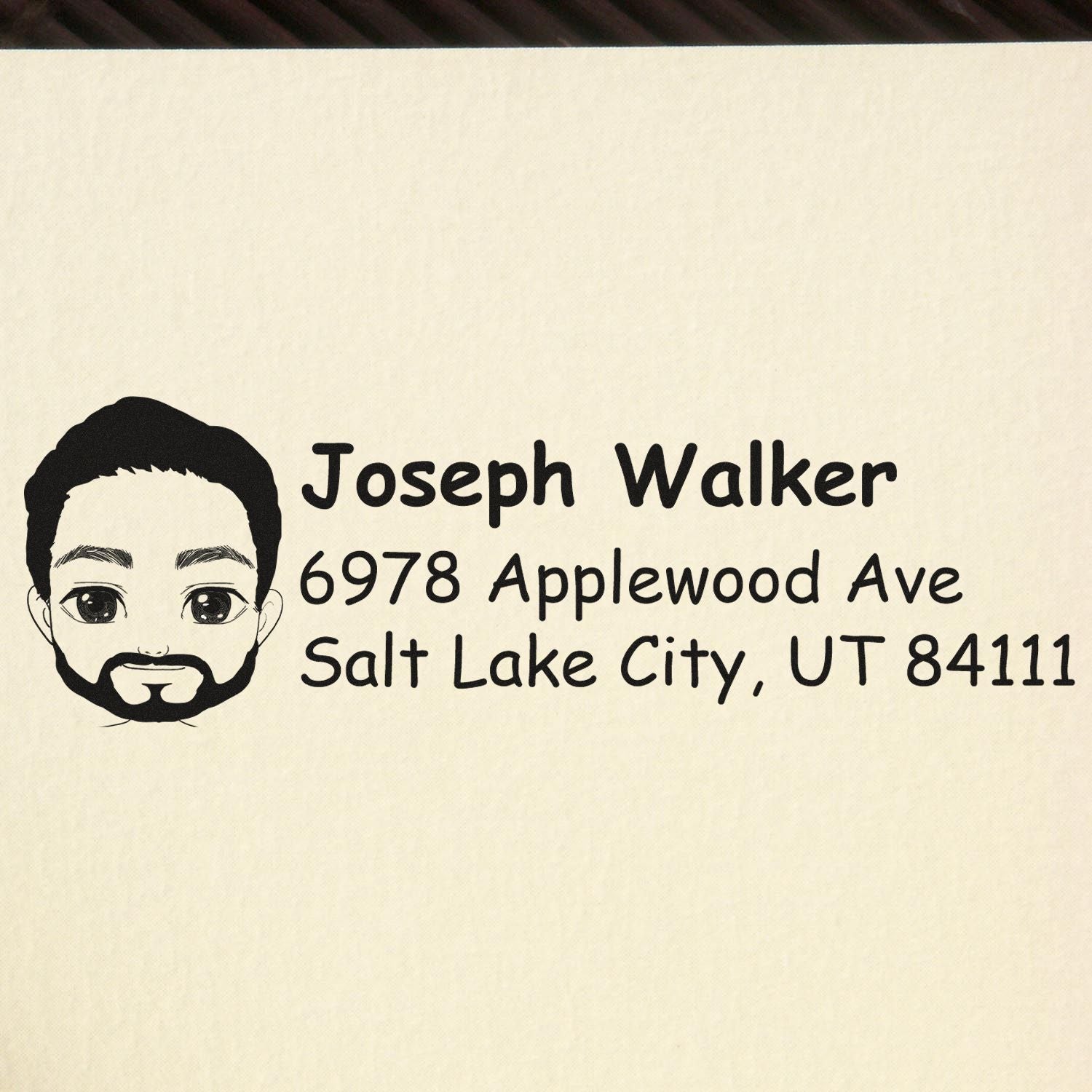 Personalized rubber stamp with cartoon portrait and return address for Joseph Walker, Salt Lake City, UT 84111.