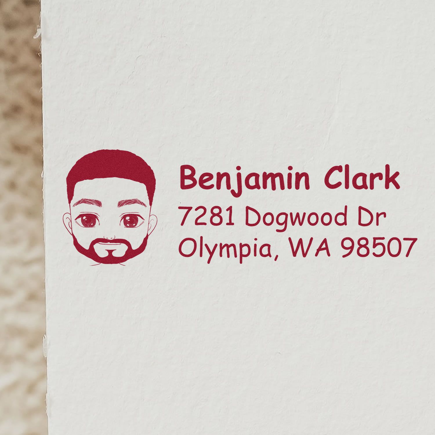 Custom return address rubber stamp with illustrated male portrait for Benjamin Clark, Olympia, WA 98507.