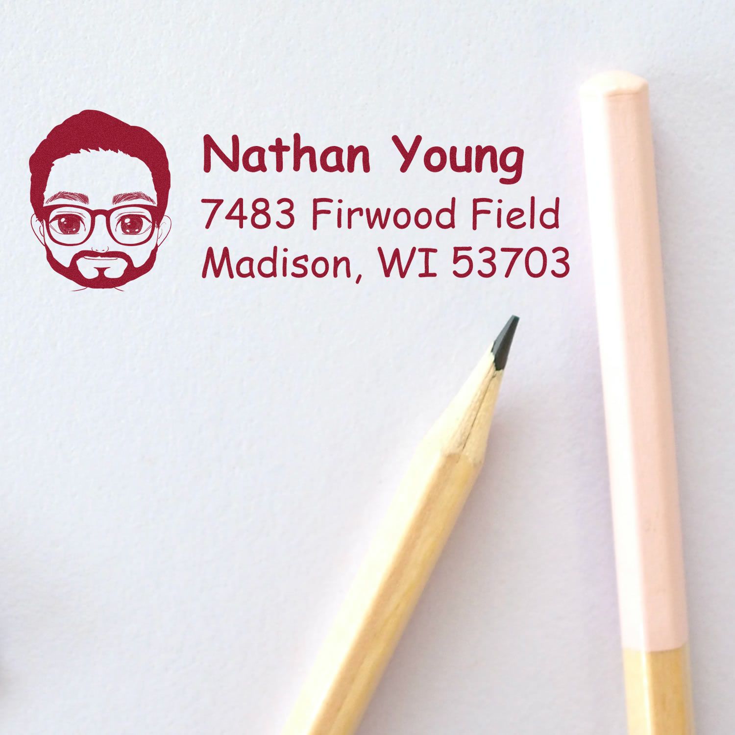 Custom rubber address stamp with illustrated avatar, Nathan Young return address for envelopes and mail in Madison, WI.