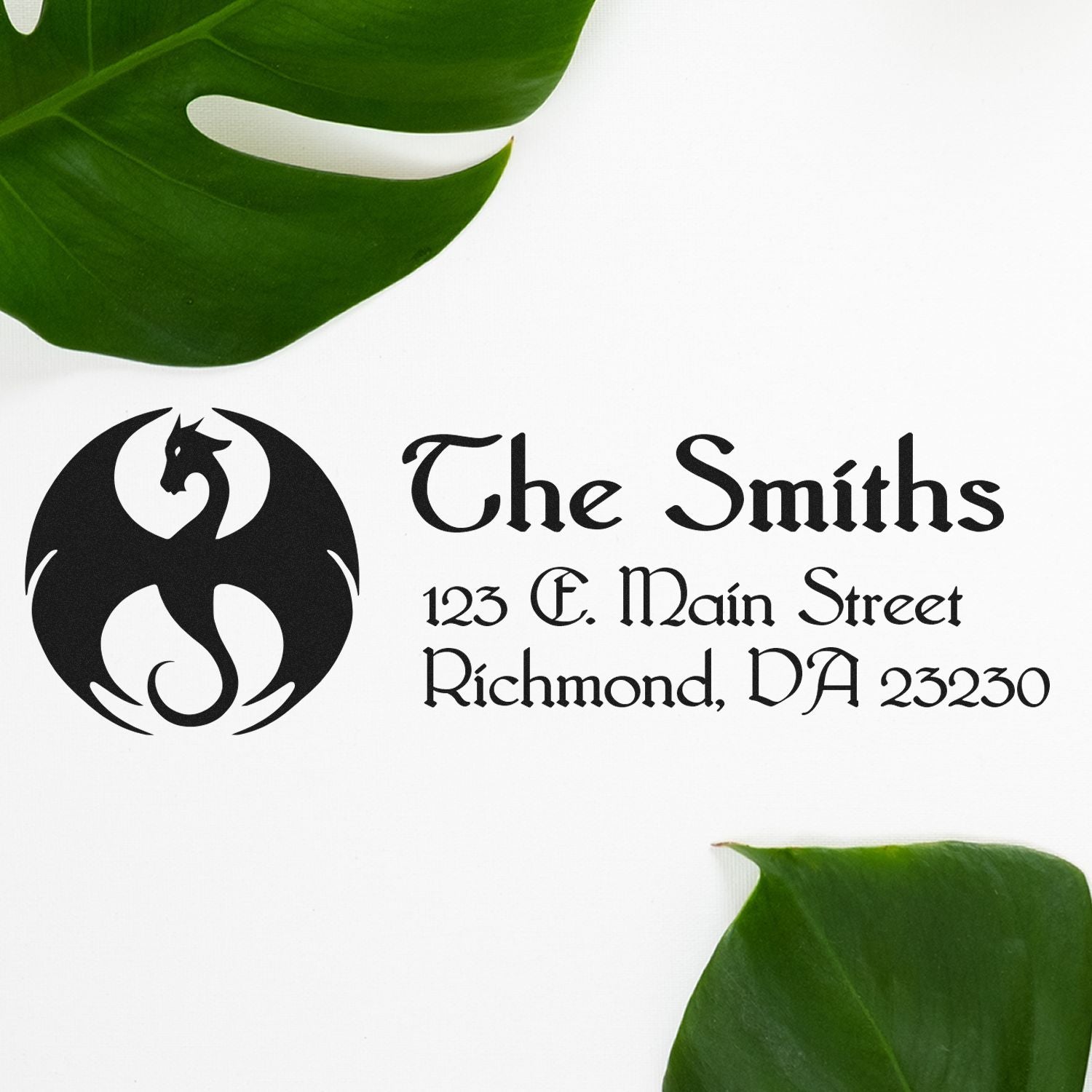 Custom rubber address stamp for The Smiths with dragon logo, 123 E. Main Street, Richmond, VA 23230.