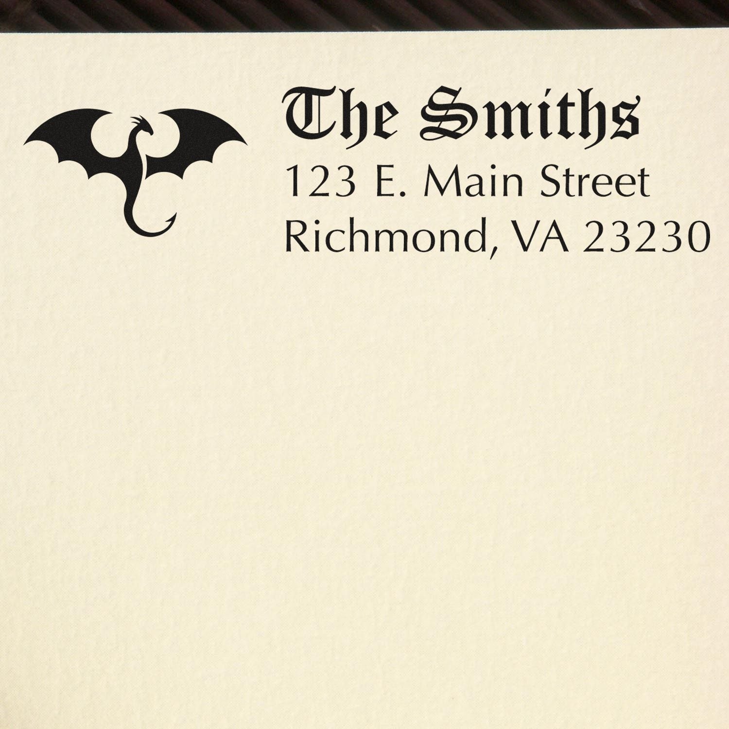 Personalized rubber address stamp for The Smiths with dragon logo and Richmond, VA mailing address.