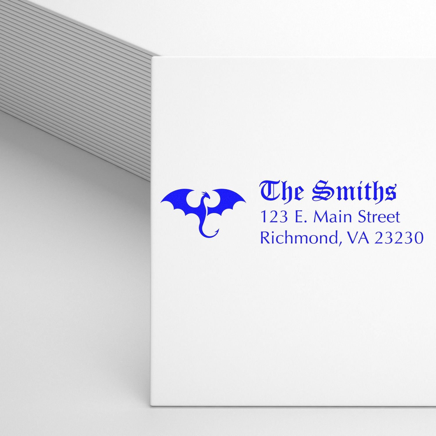 Custom return address rubber stamp with dragon logo for The Smiths, Richmond, VA address on envelopes and stationery.