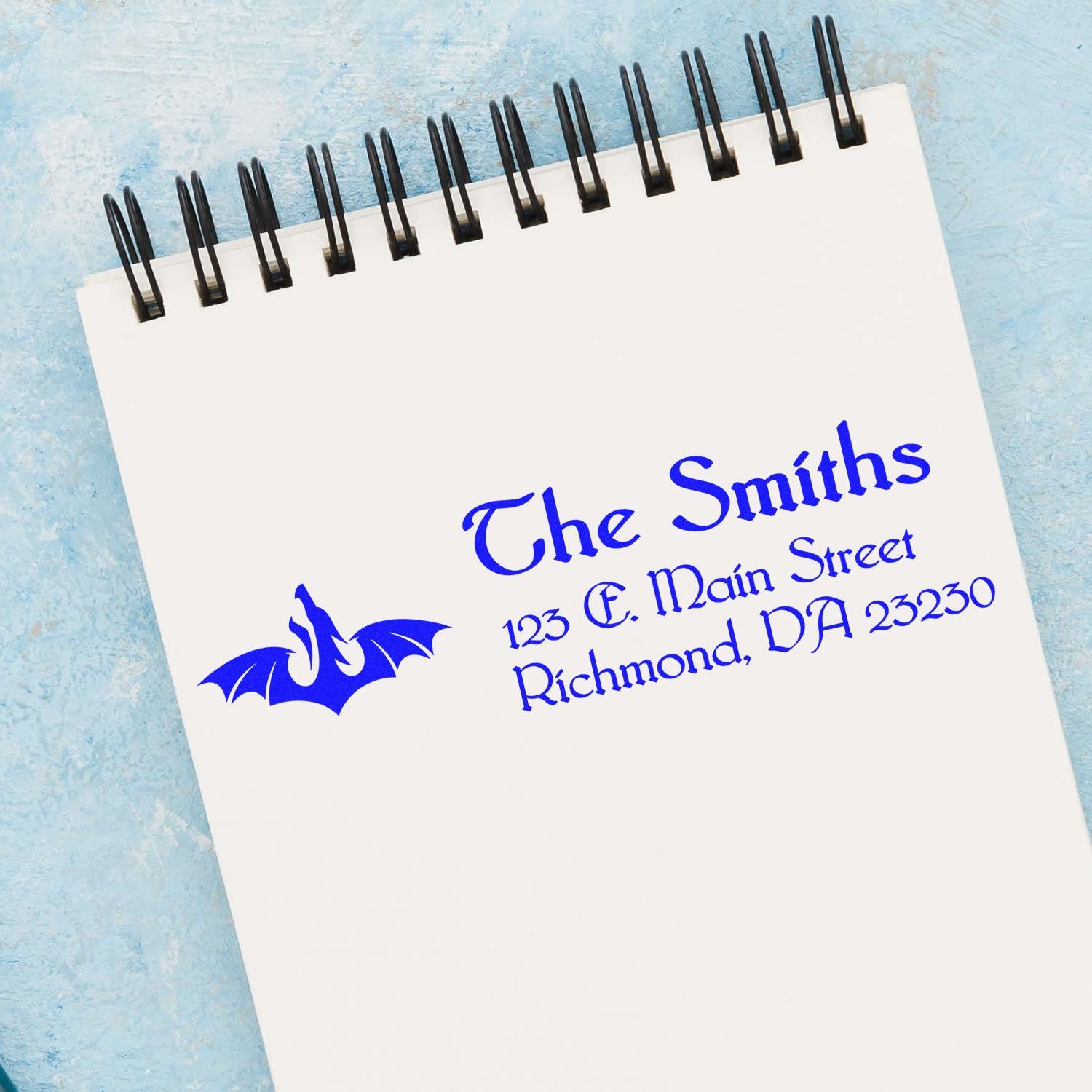 Personalized custom rubber stamp return address for The Smiths with dragon logo, perfect for envelopes and stationery.