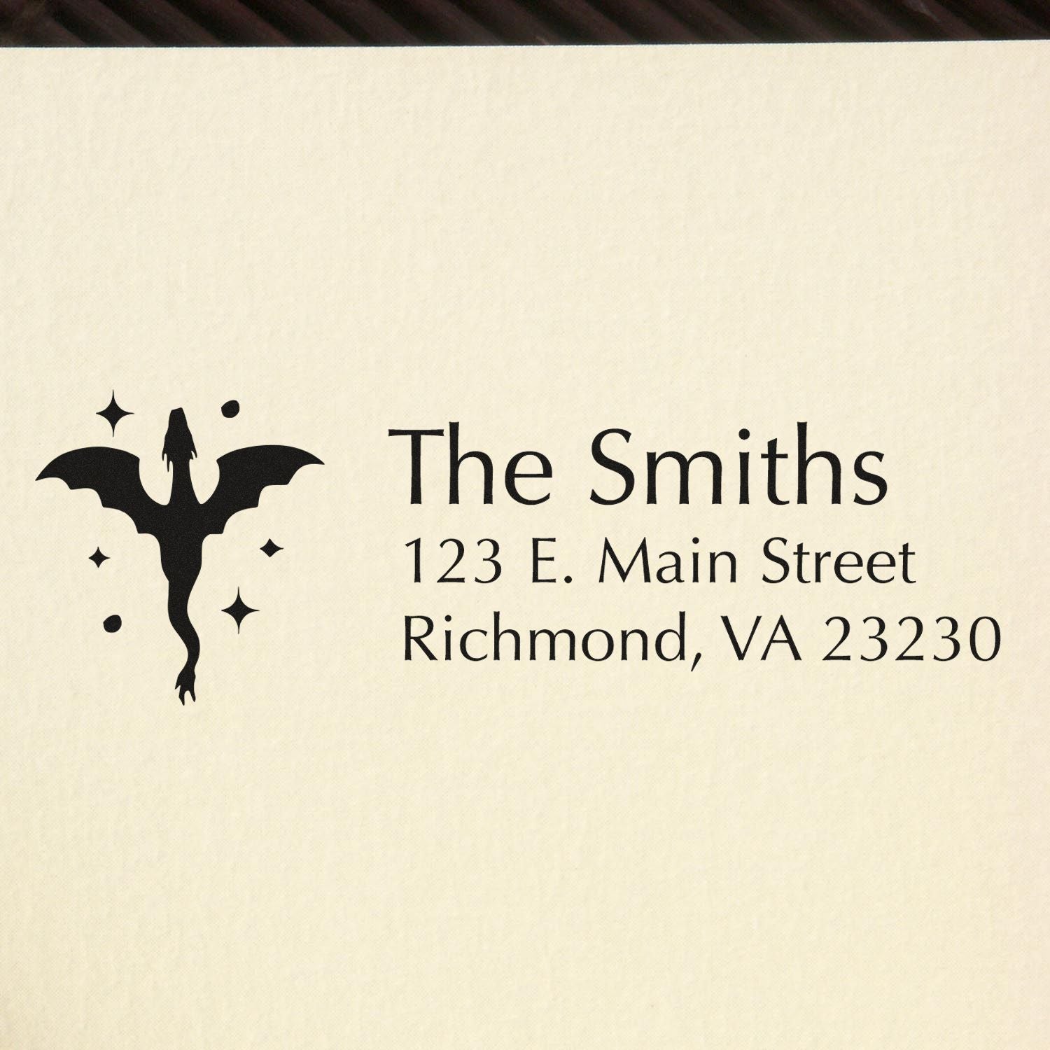 Custom family address rubber stamp for The Smiths, 123 E. Main Street, Richmond, VA 23230, with bat logo.