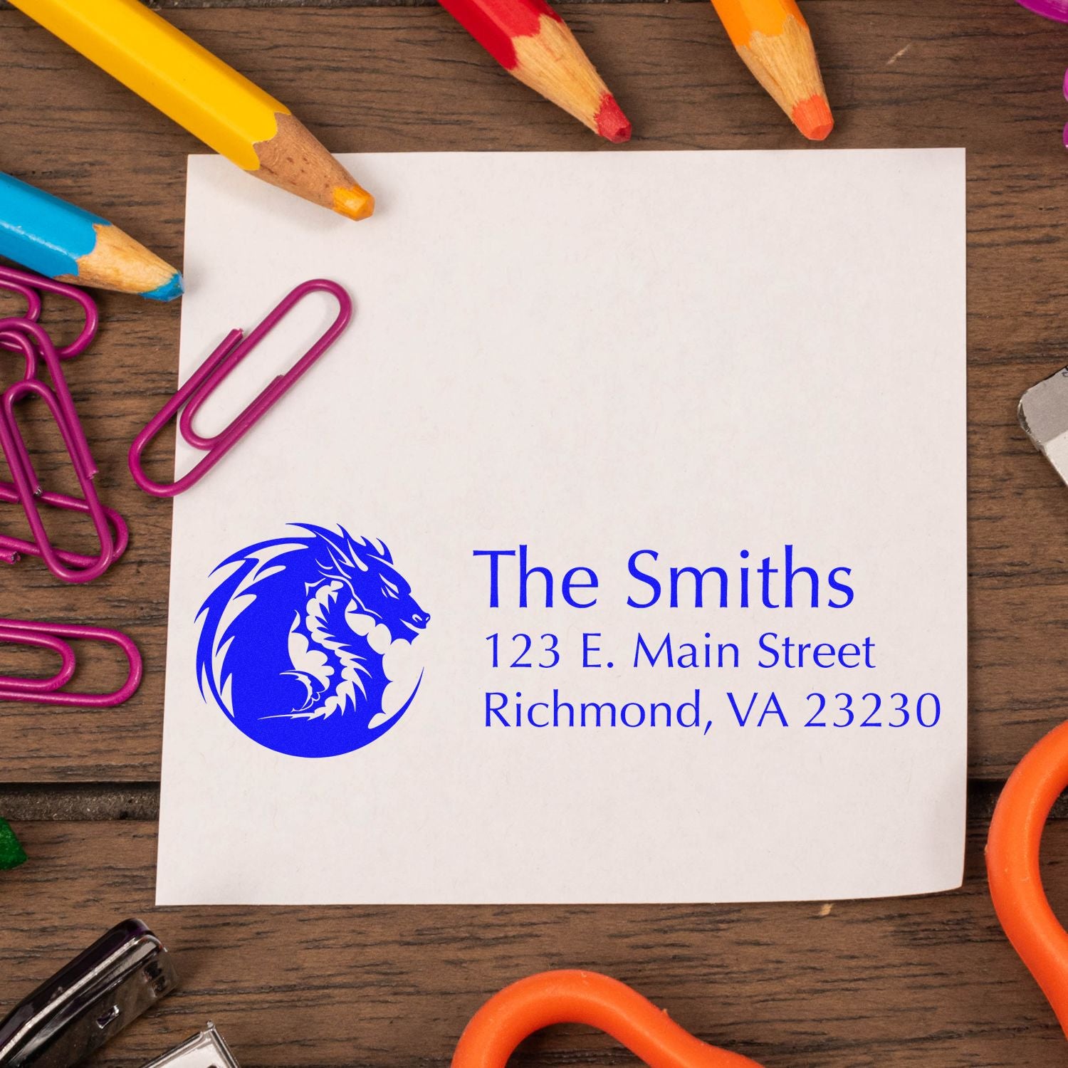 Custom rubber return address stamp for The Smiths with blue dragon logo and Richmond, VA mailing address on stationery.