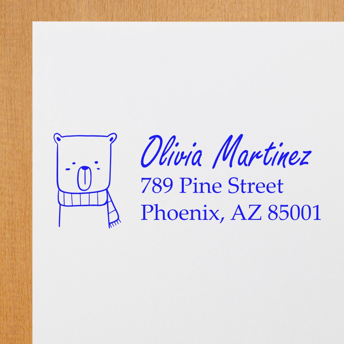 Personalized return address rubber stamp with bear icon for Olivia Martinez, Phoenix, AZ 85001.