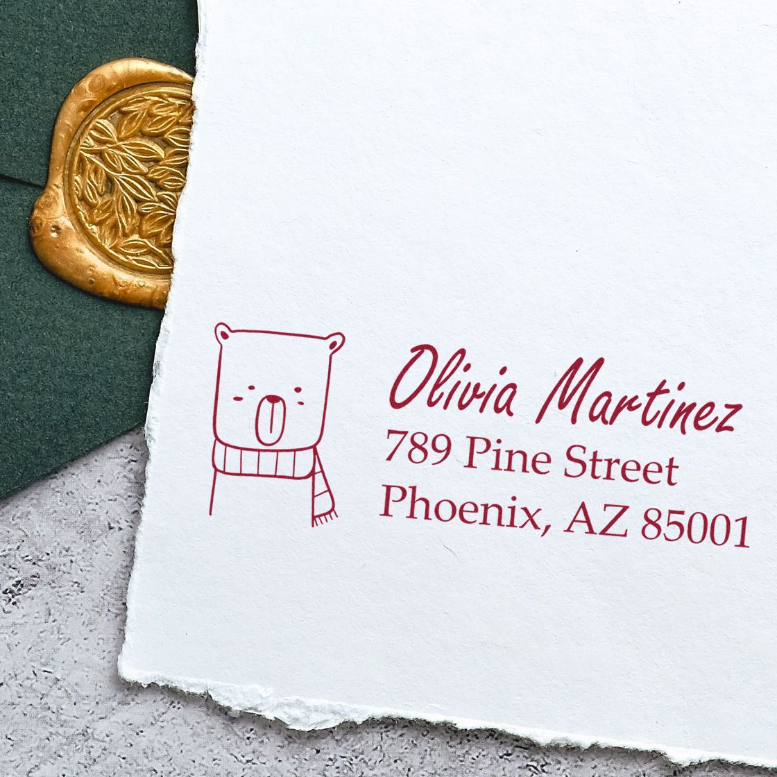 Custom return address rubber stamp with bear icon, Olivia Martinez, 789 Pine Street, Phoenix, AZ 85001.