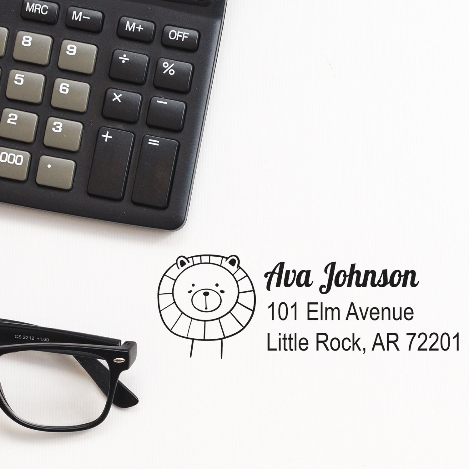 Custom rubber return address stamp with bear logo, Ava Johnson, and Little Rock, AR address for mailing.