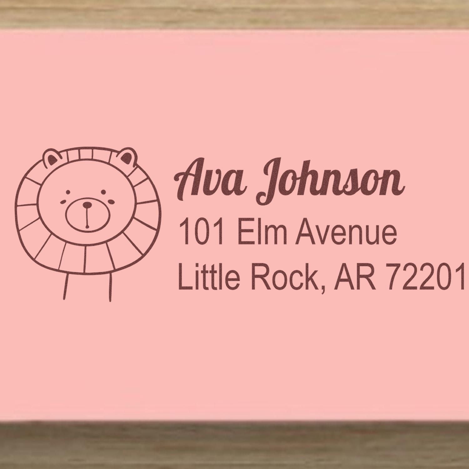 Custom address rubber stamp with bear design for Ava Johnson, 101 Elm Avenue, Little Rock, AR 72201.