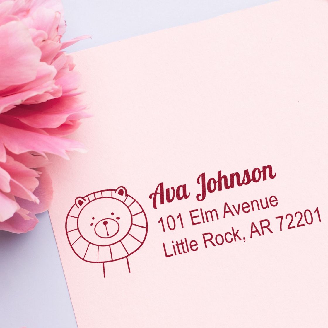 Personalized custom rubber address stamp with lion design for Ava Johnson, 101 Elm Avenue, Little Rock, AR 72201.