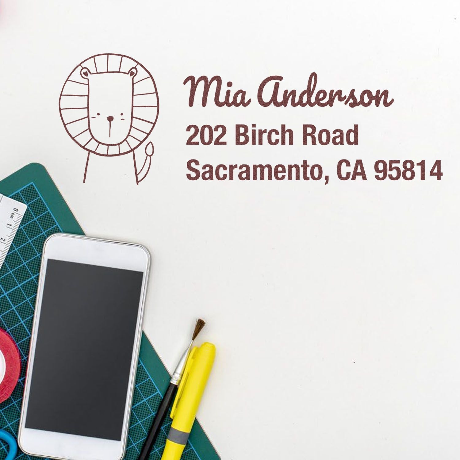 Personalized custom rubber address stamp with lion design for Mia Anderson, Sacramento, CA 95814
