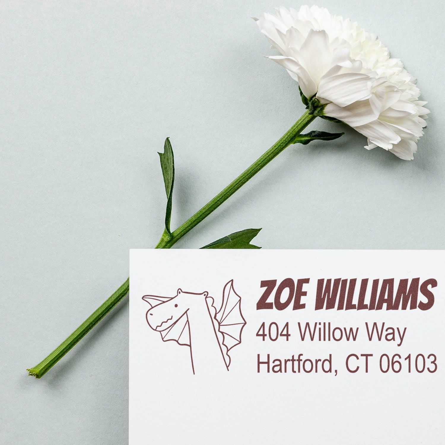 Custom return address rubber stamp with dragon design, showing Zoe Williams name and Hartford, CT address sample.