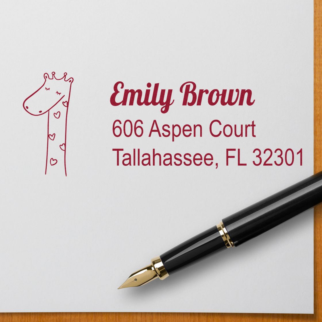 Personalized rubber address stamp with giraffe design for Emily Brown, 606 Aspen Court, Tallahassee, FL 32301
