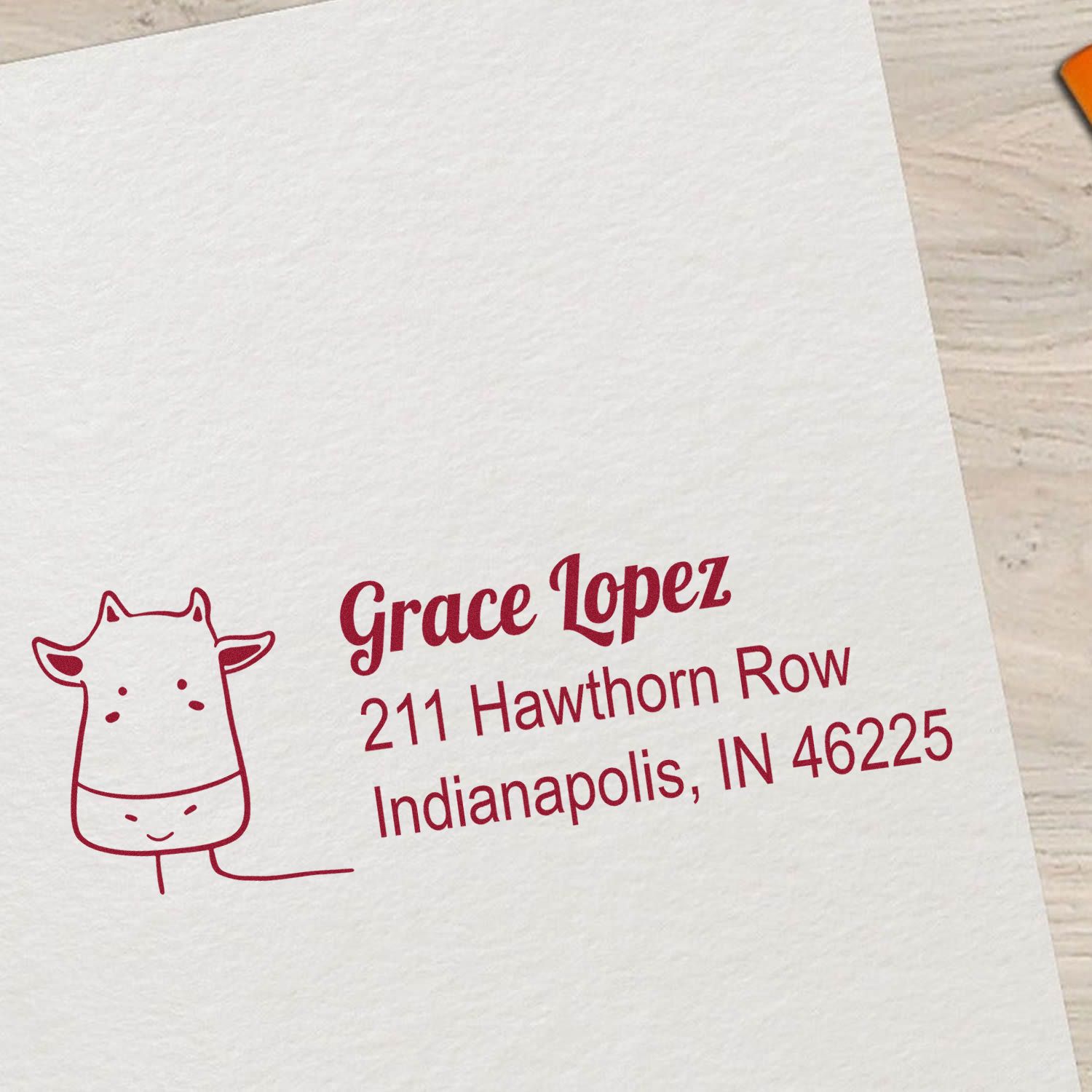 Custom rubber return address stamp with giraffe design for Grace Lopez, Indianapolis, IN 46225.