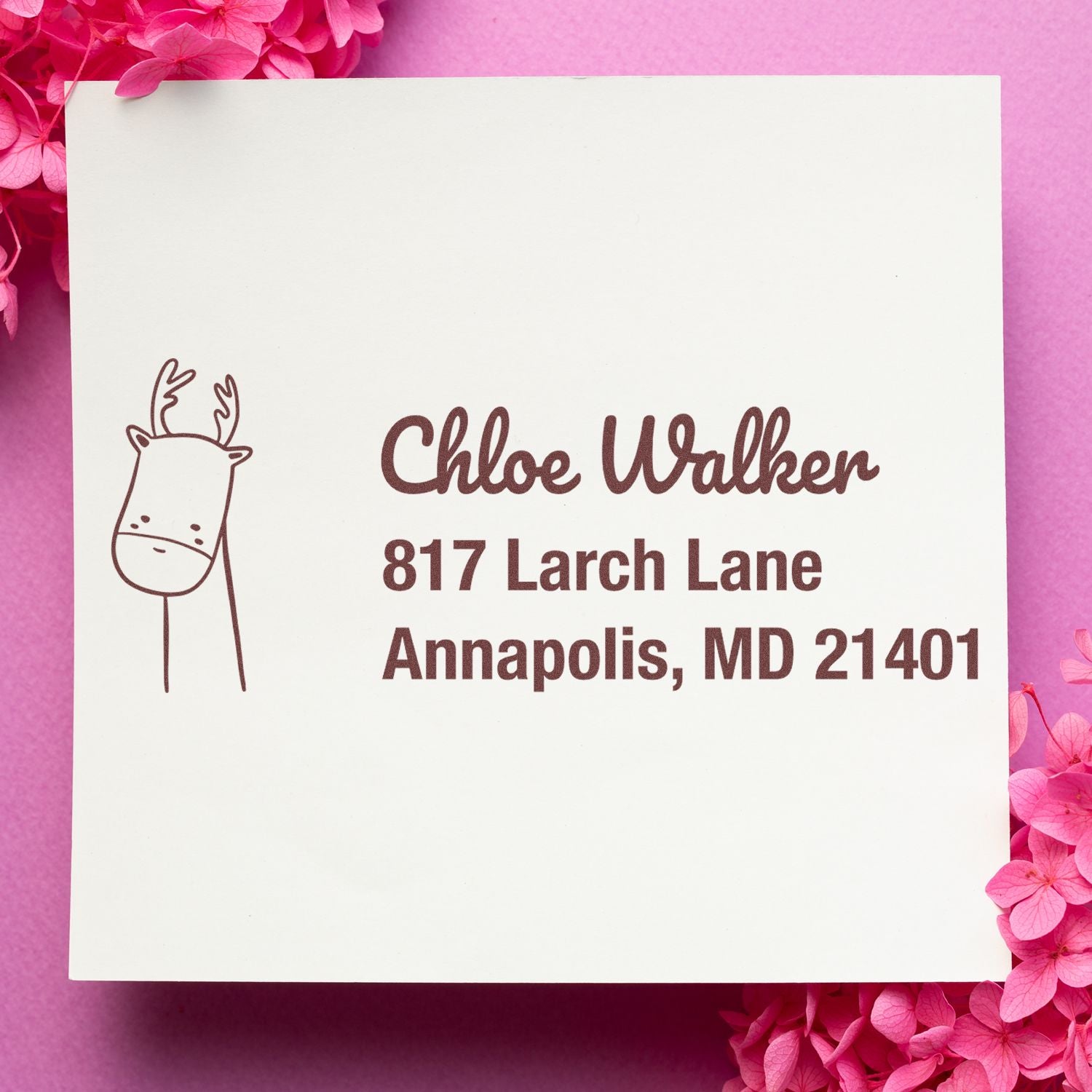 Personalized rubber address stamp with deer antler design for Chloe Walker, 817 Larch Lane, Annapolis, MD 21401.